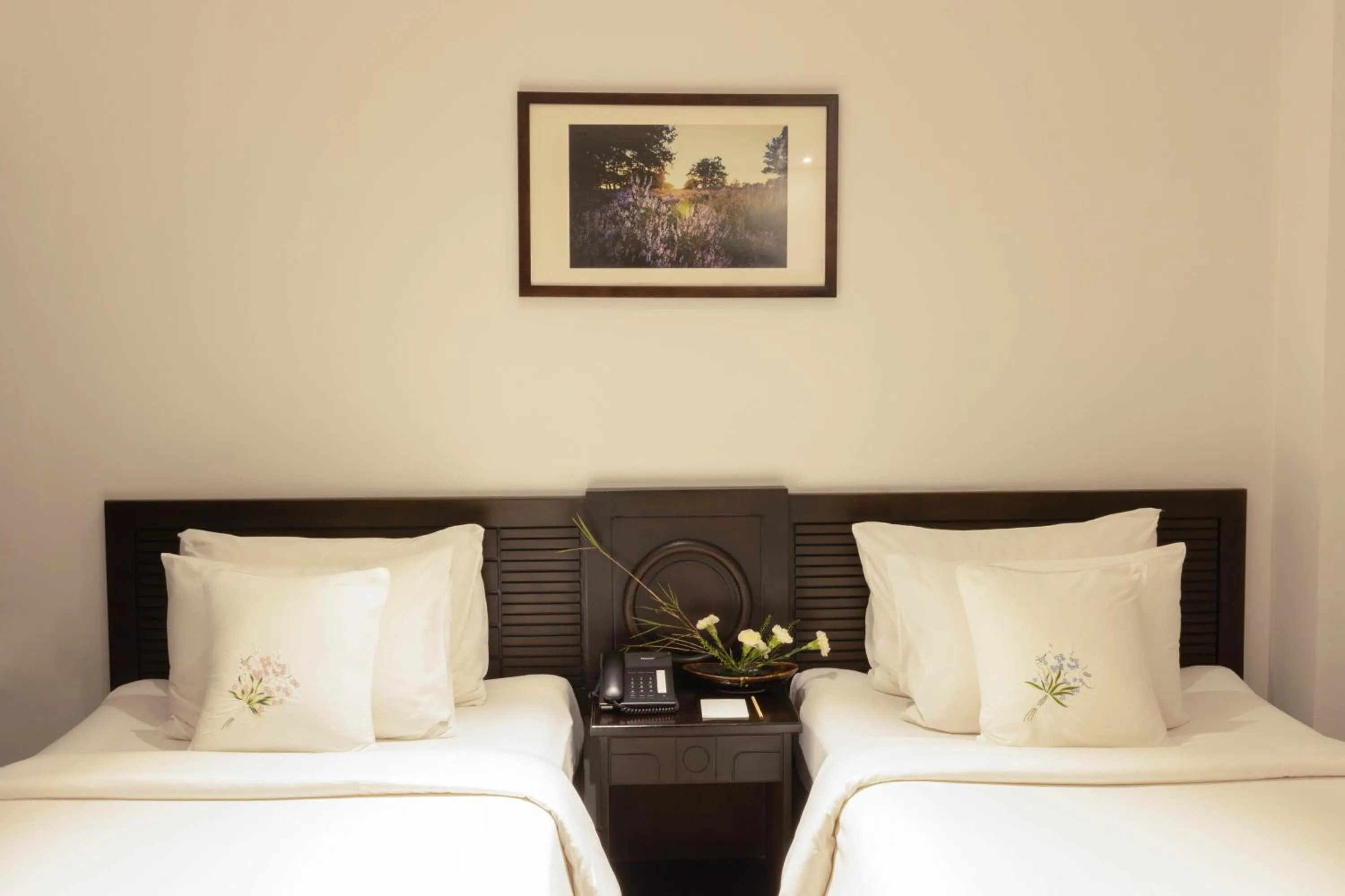 Bed in Cochin Zen Hotel