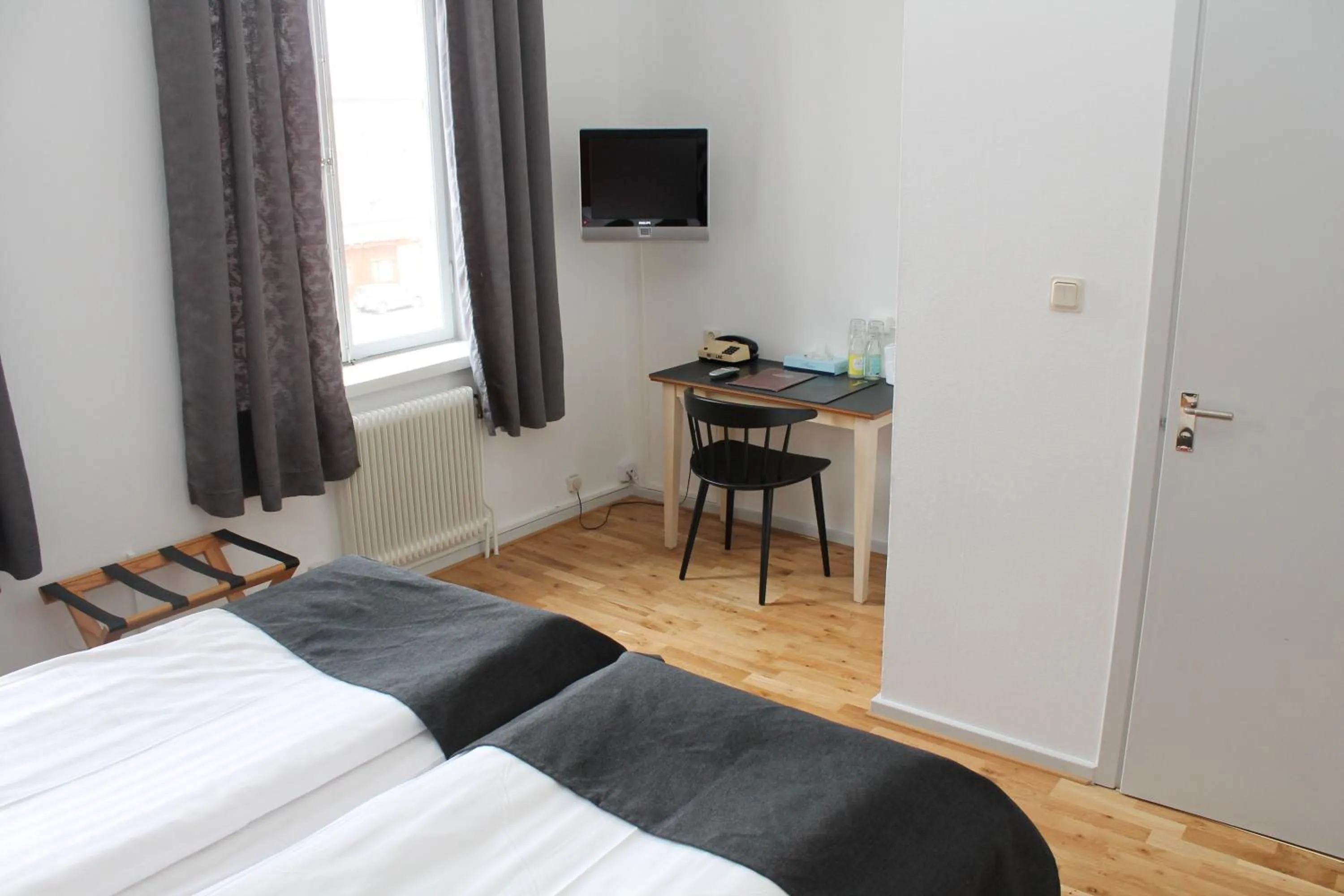 Photo of the whole room, Bed in Lindesbergs Stadshotell