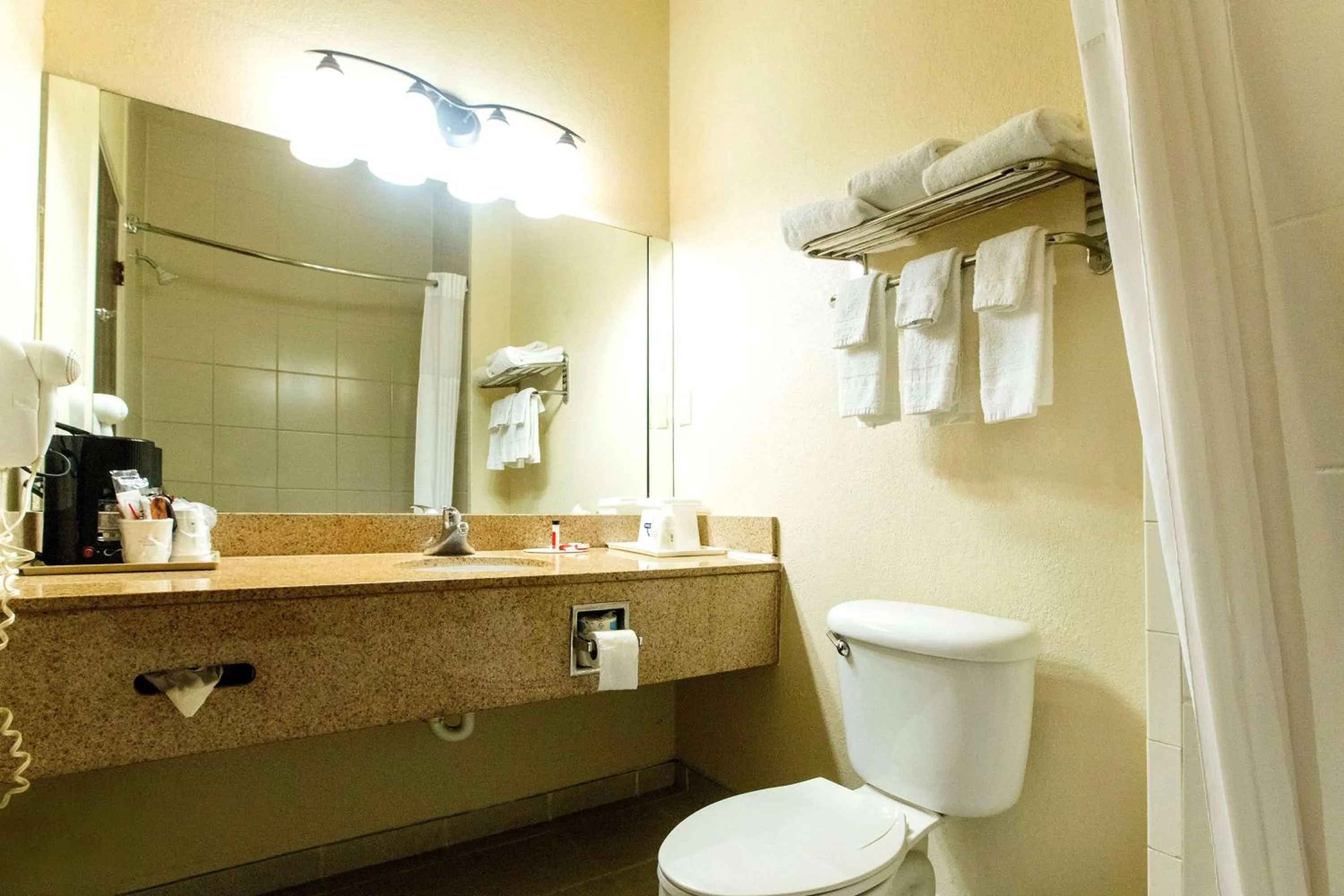 Bathroom in Days Inn & Suites by Wyndham Houston North/Aldine