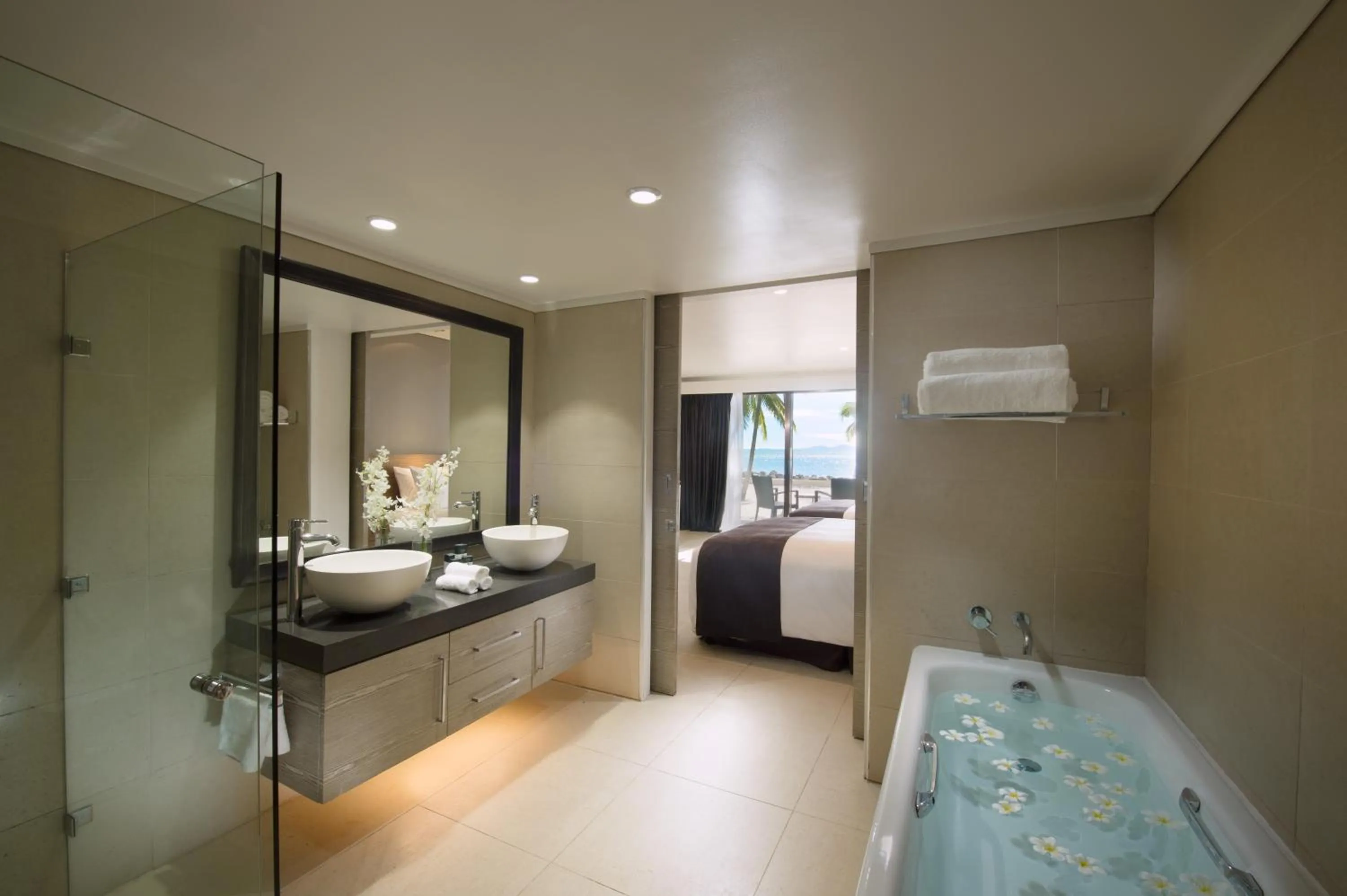Bathroom, Bed in DoubleTree by Hilton Fiji - Sonaisali Island