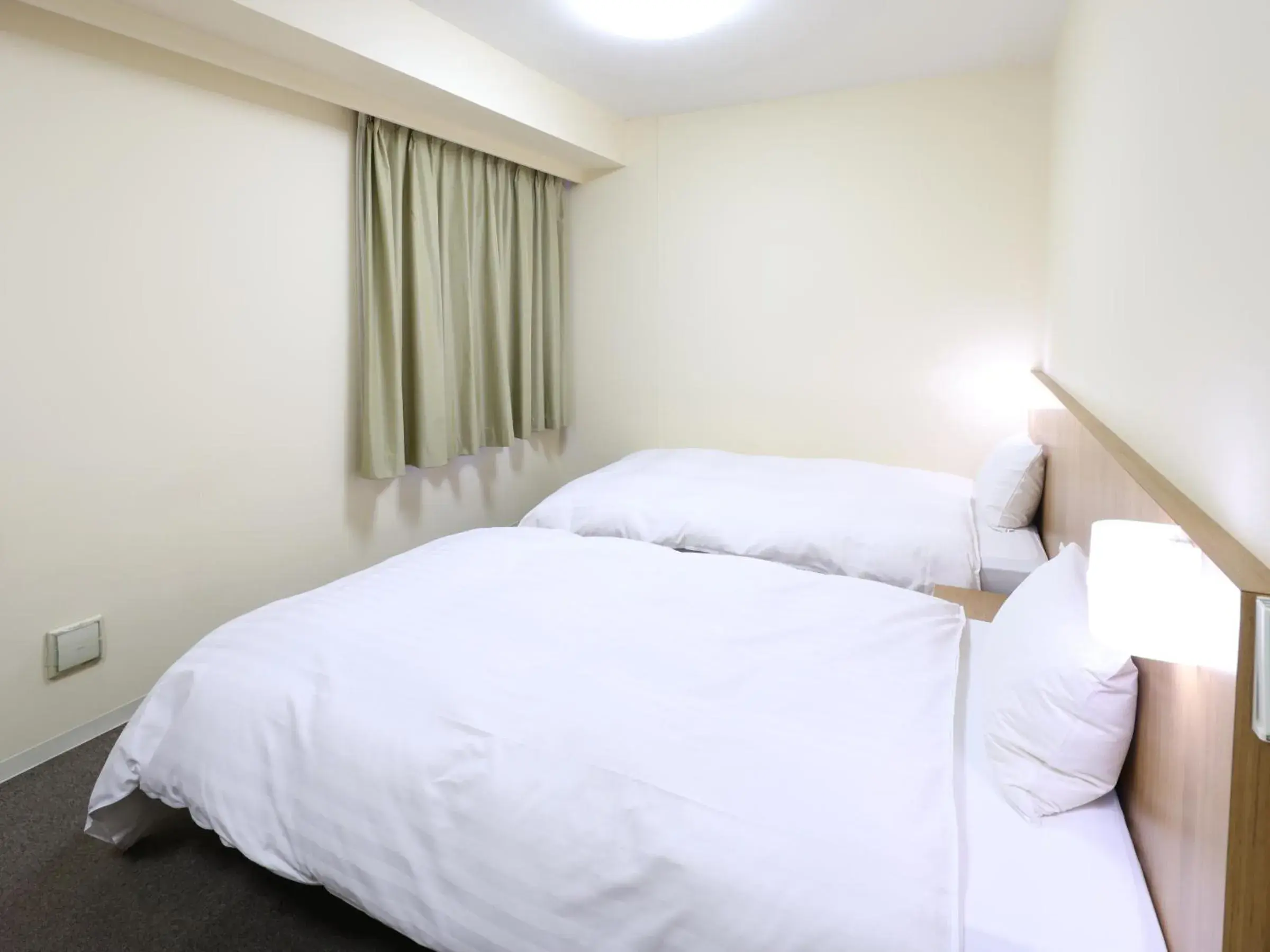 Bed in Dormy Inn Express Mikawaanjo Bed in Dormy Inn Express Mikawaanjo