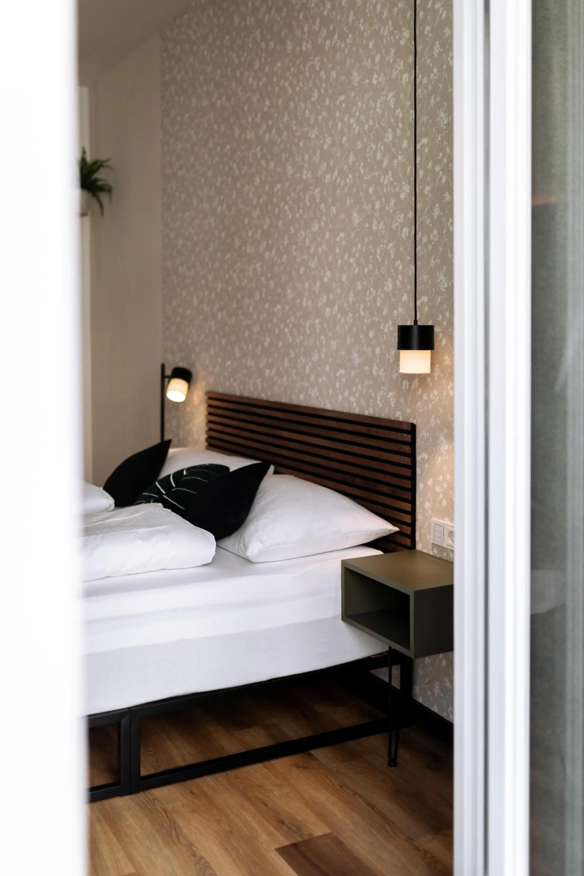 Bed in Urban Jungle Apartments