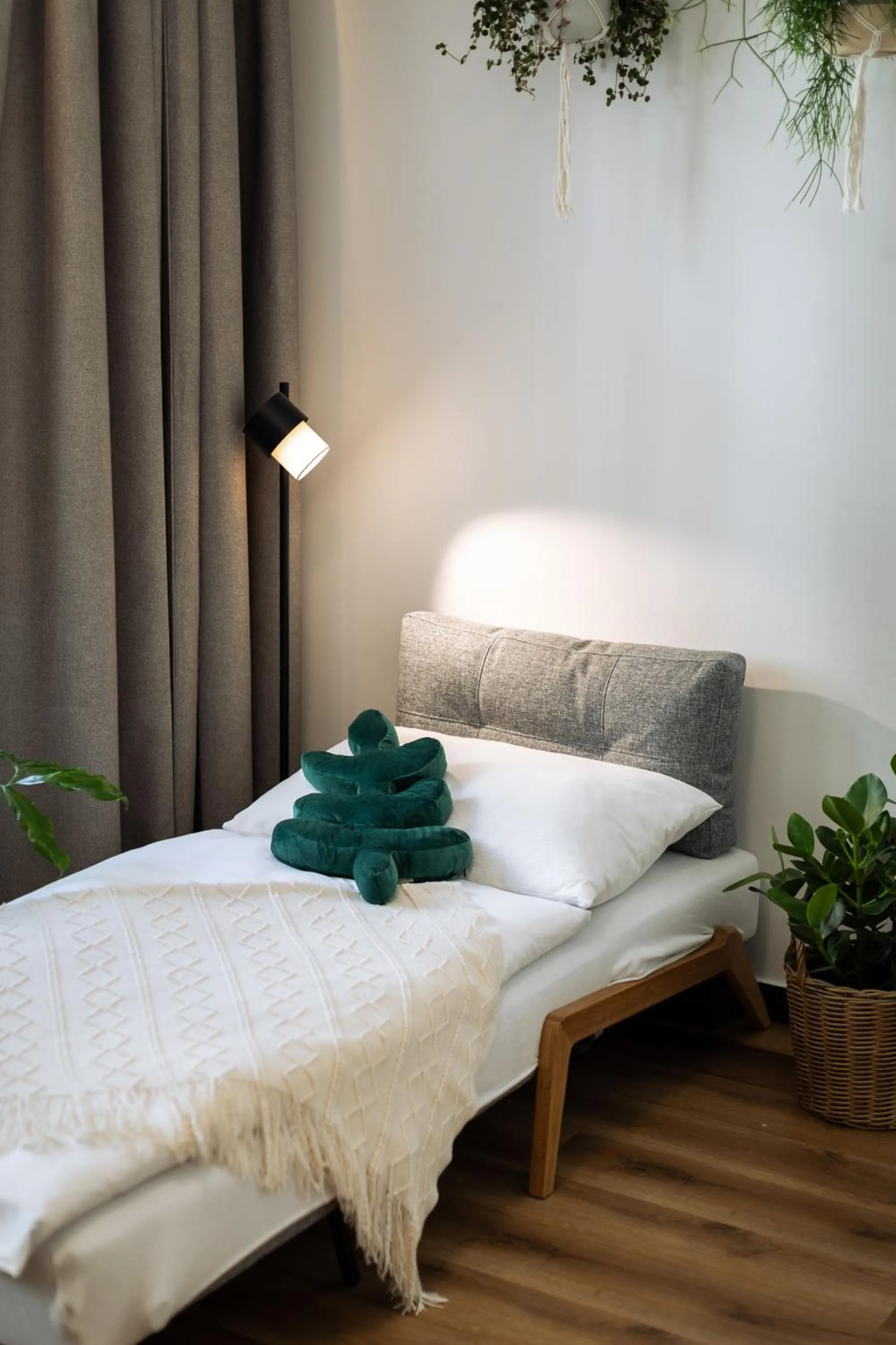 Bed in Urban Jungle Apartments