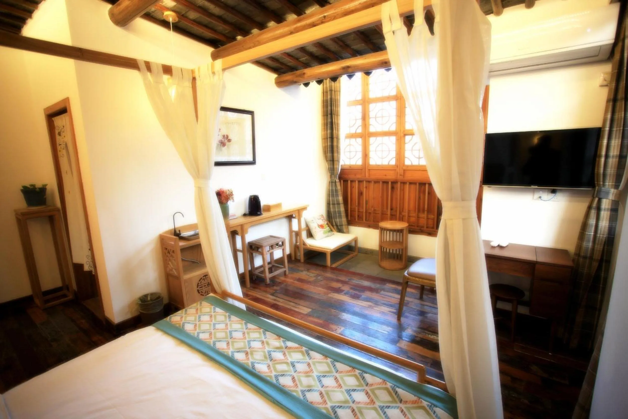 Communal lounge/ TV room, Bed in Tongli Begonia Flowers Guesthouse