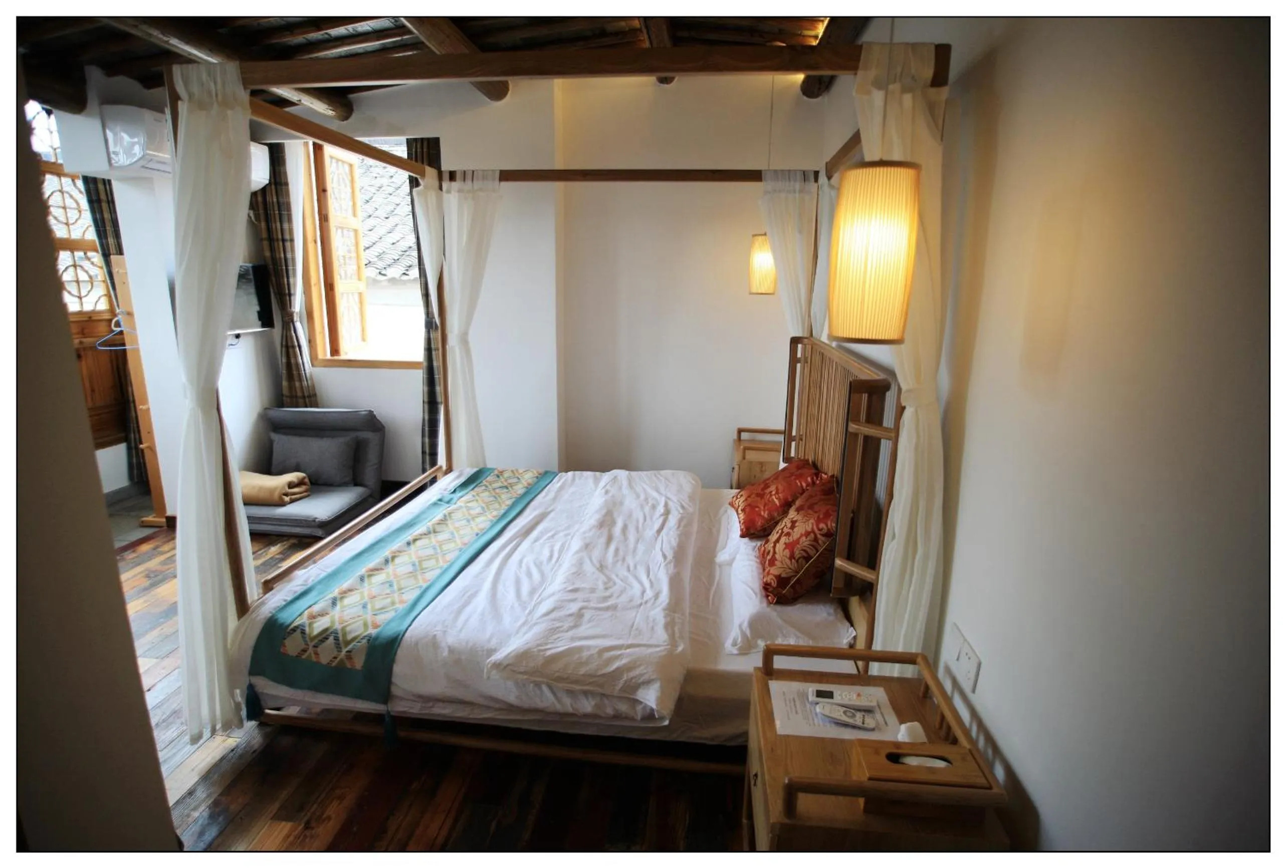 Bed in Tongli Begonia Flowers Guesthouse