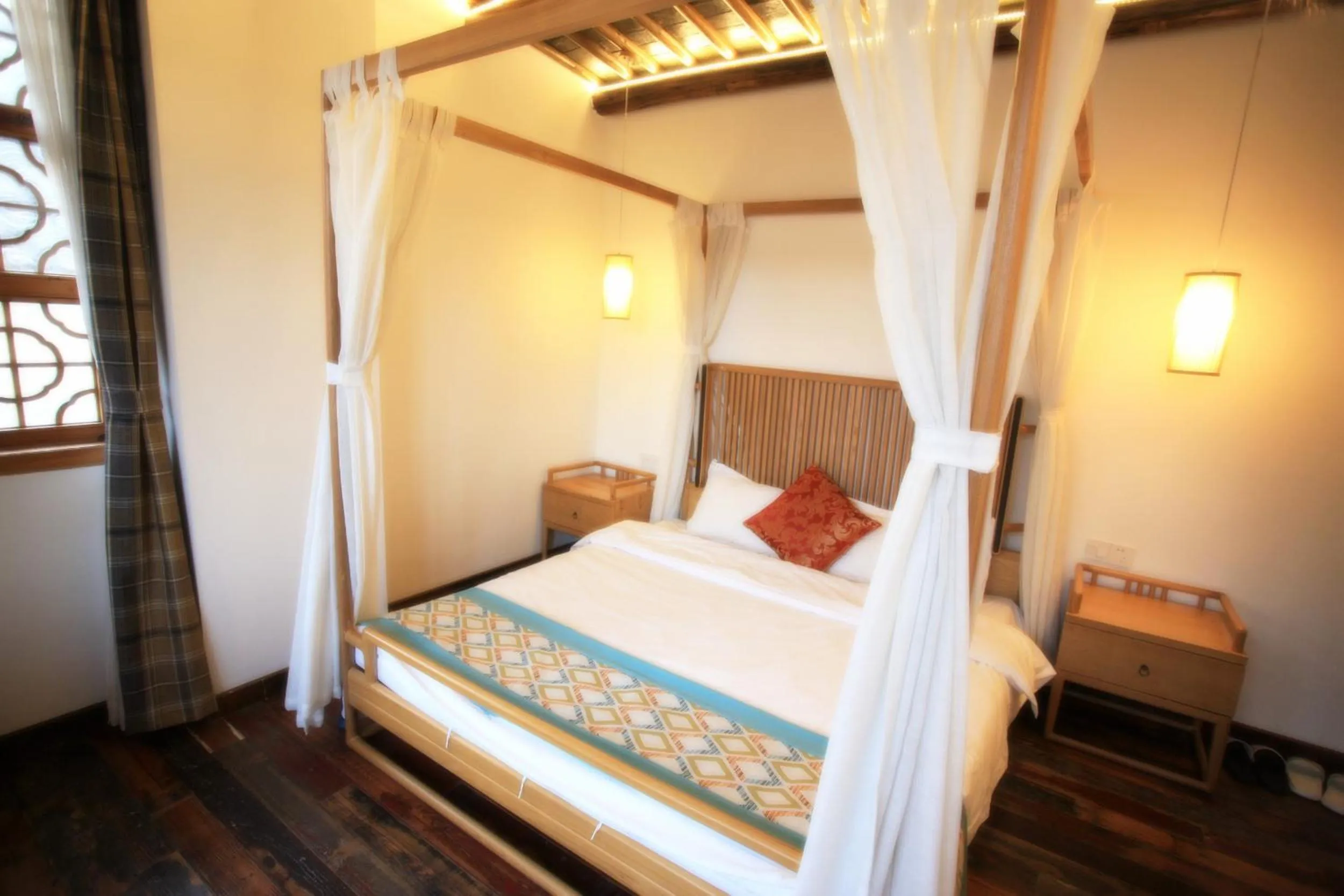 Bed in Tongli Begonia Flowers Guesthouse