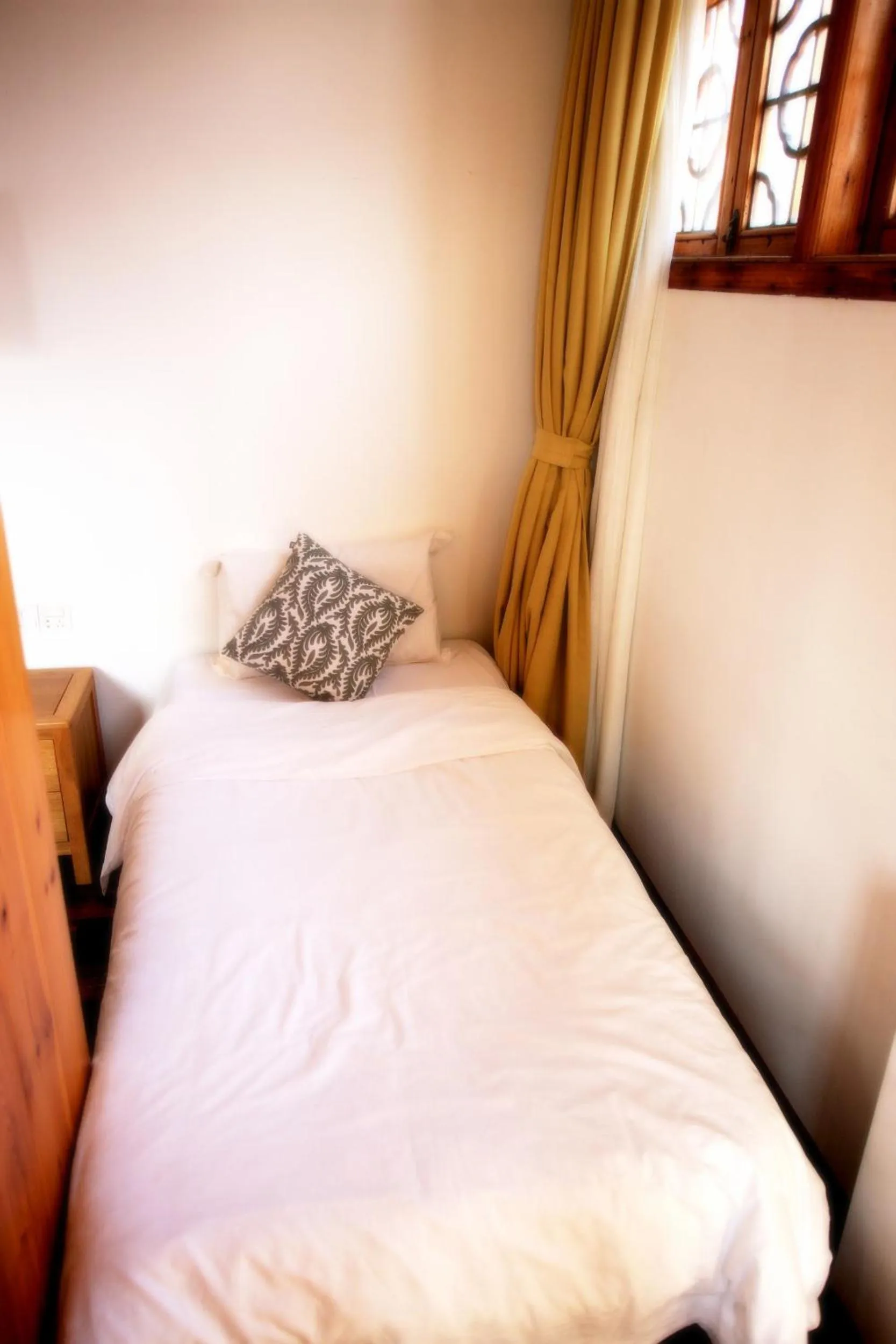 Bed in Tongli Begonia Flowers Guesthouse