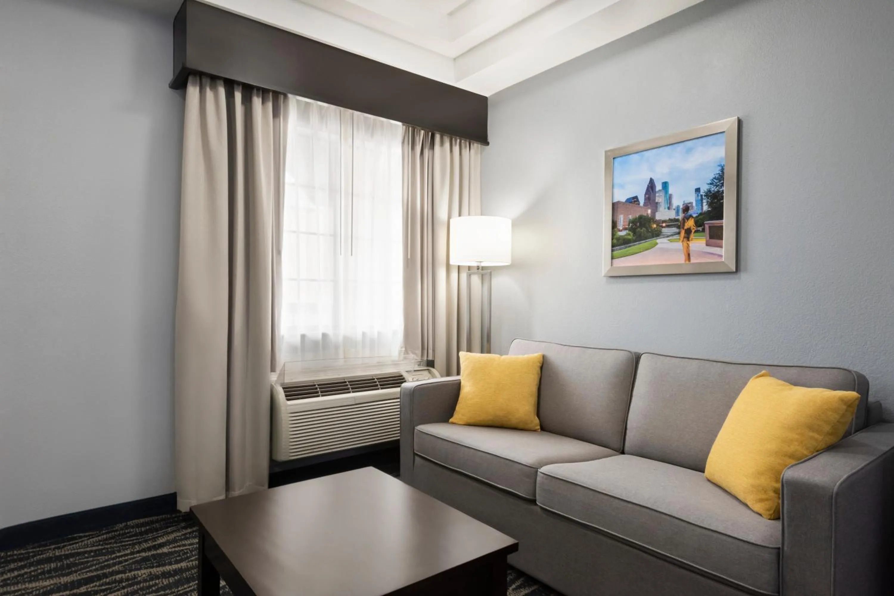 Seating area in Days Inn & Suites by Wyndham Houston Hobby Airport