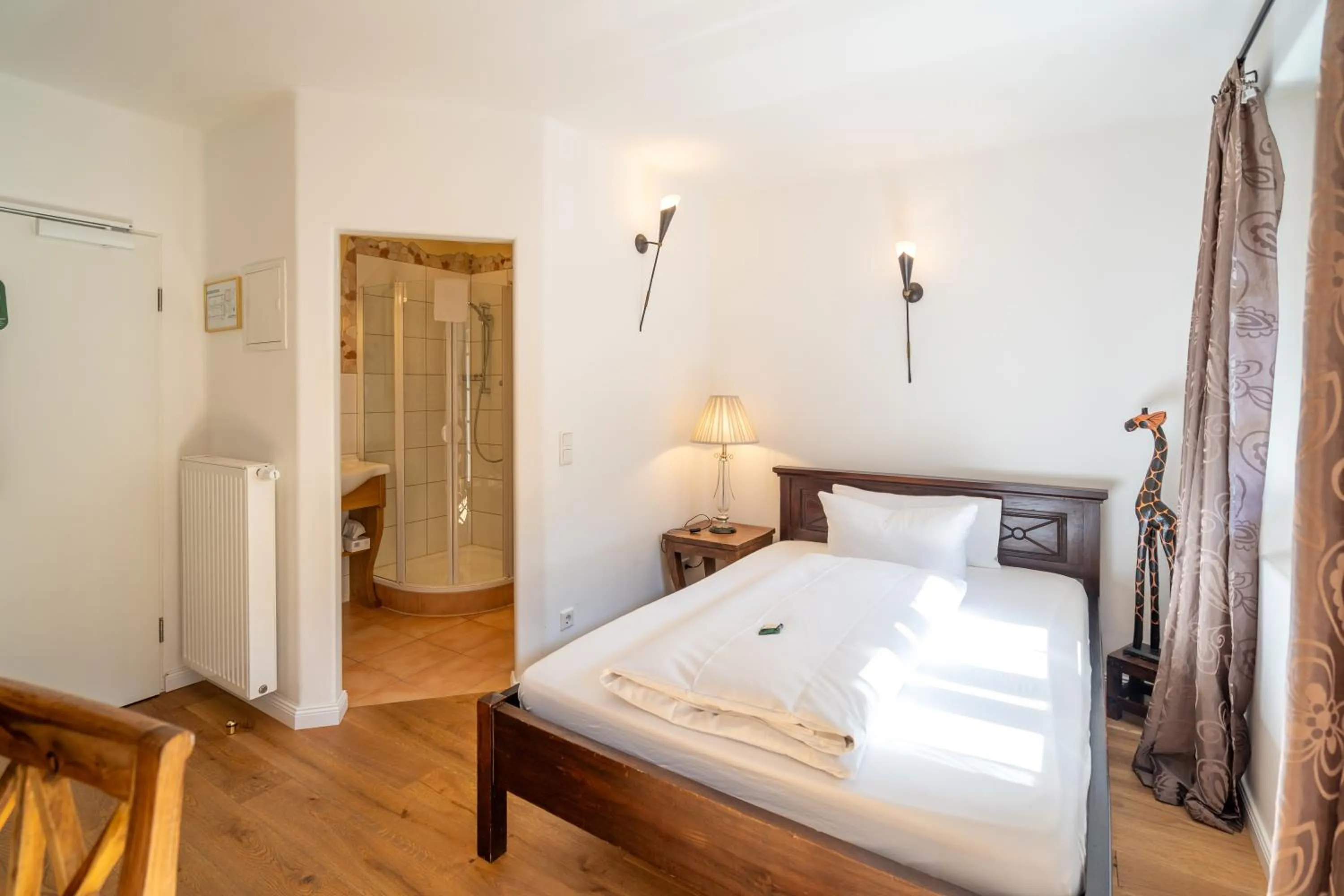 Photo of the whole room, Bed in Landhaus Hotel Wolfratshausen