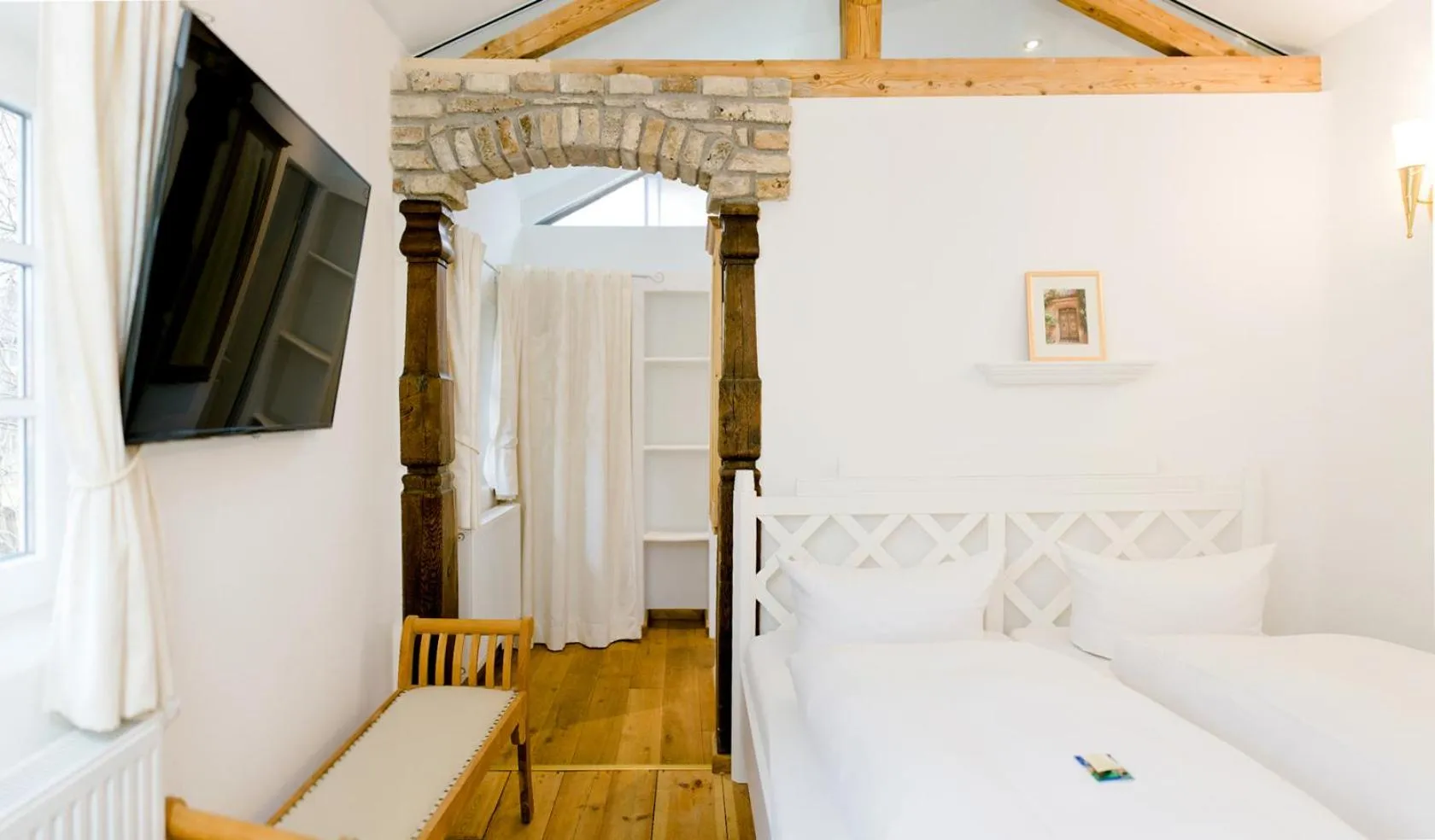 Photo of the whole room, Bed in Landhaus Hotel Wolfratshausen