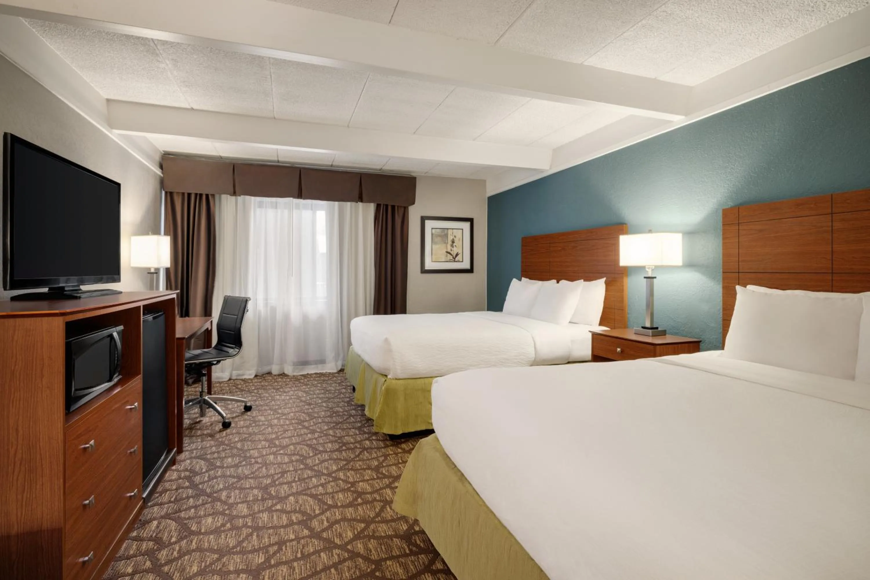 Bedroom, Bed in AmericInn by Wyndham Grand Rapids Airport North