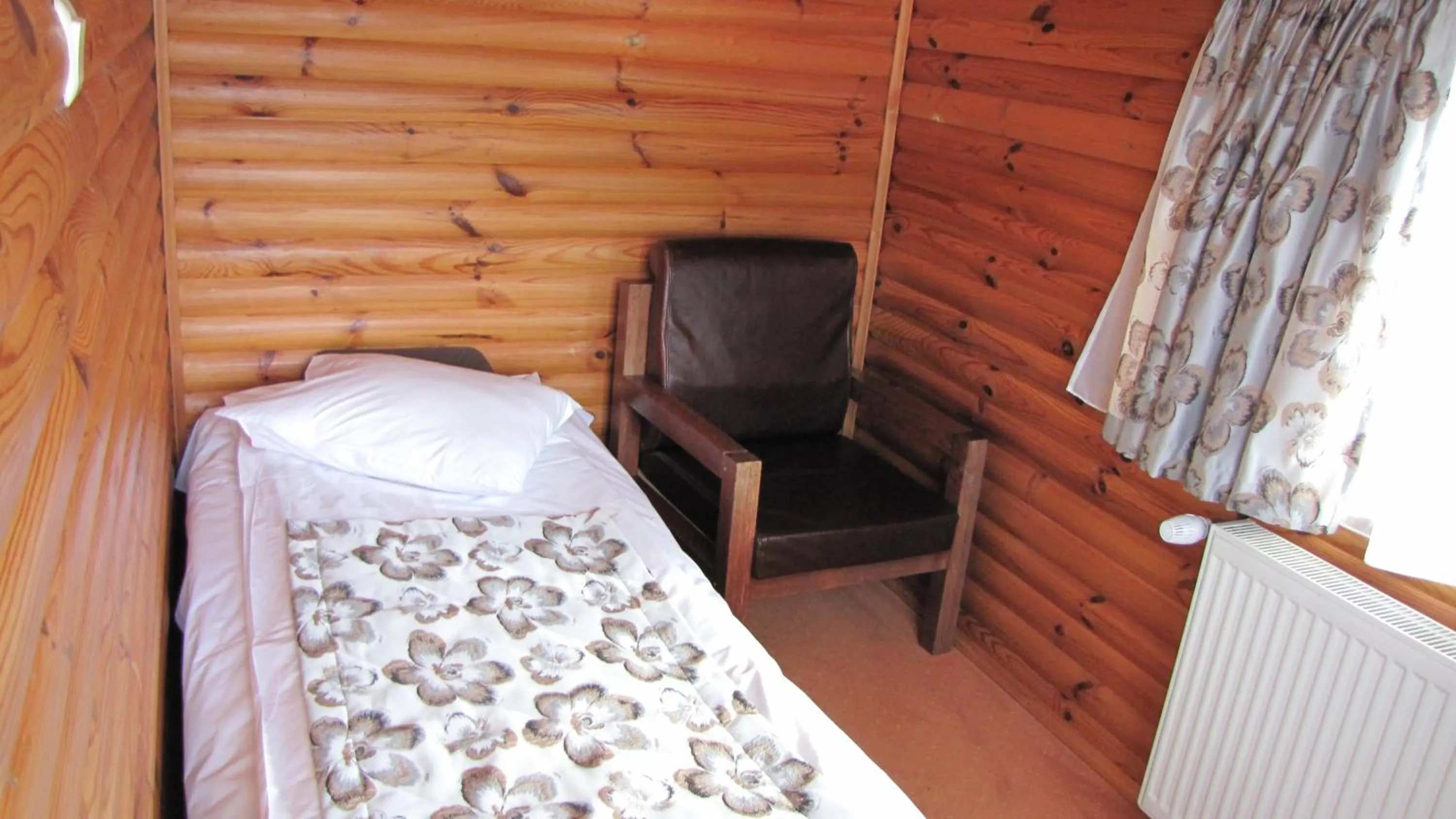 Seating area, Bed in Villa Elitte Predeal