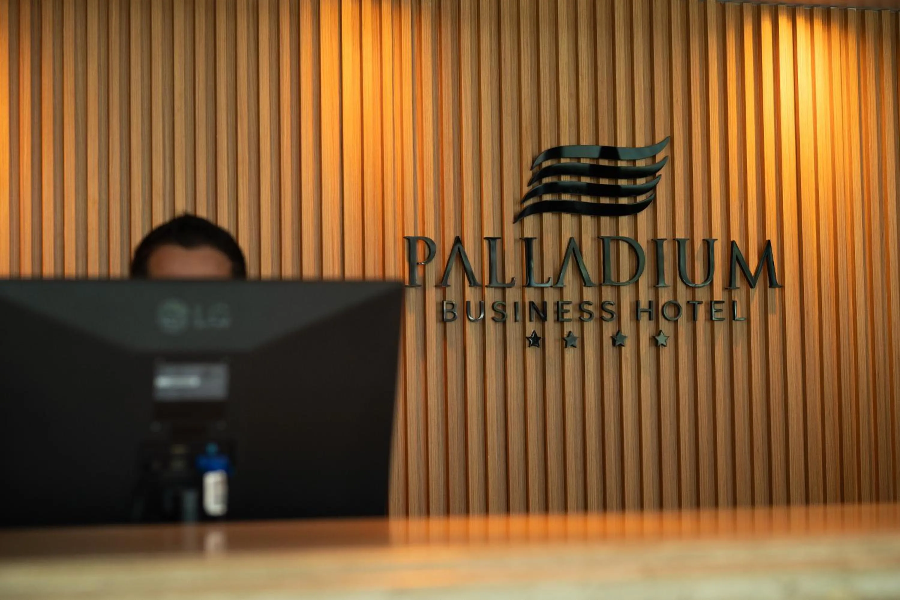 Property logo or sign in Palladium Business Hotel