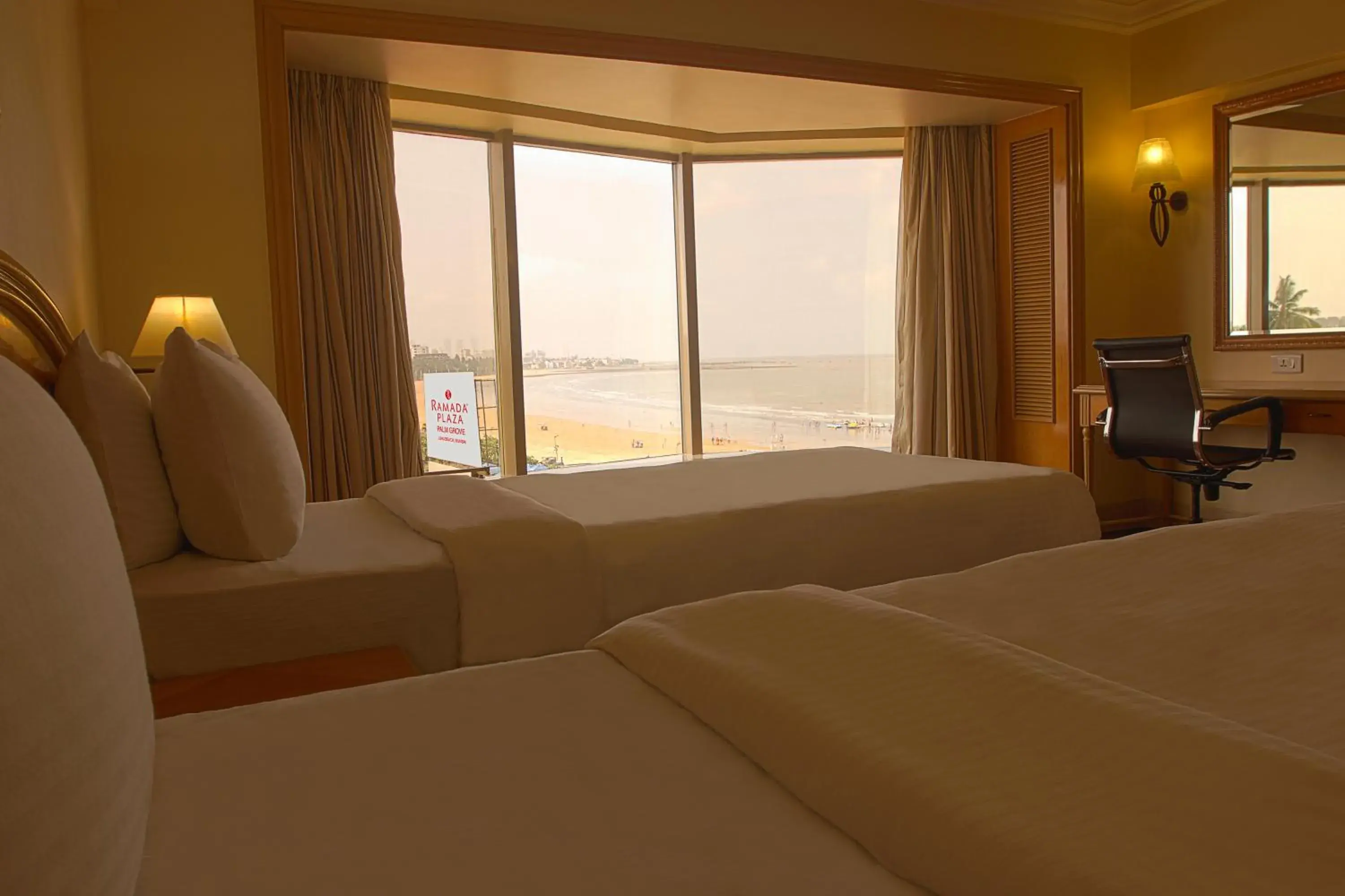 Bedroom, Bed in Ramada Plaza By Wyndham Palm Grove Bedroom, Bed in Ramada Plaza By Wyndham Palm Grove