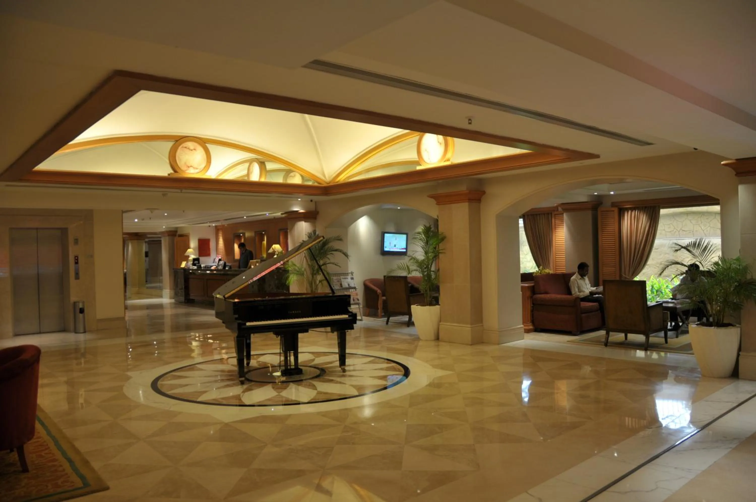 Lobby or reception in Ramada Plaza By Wyndham Palm Grove