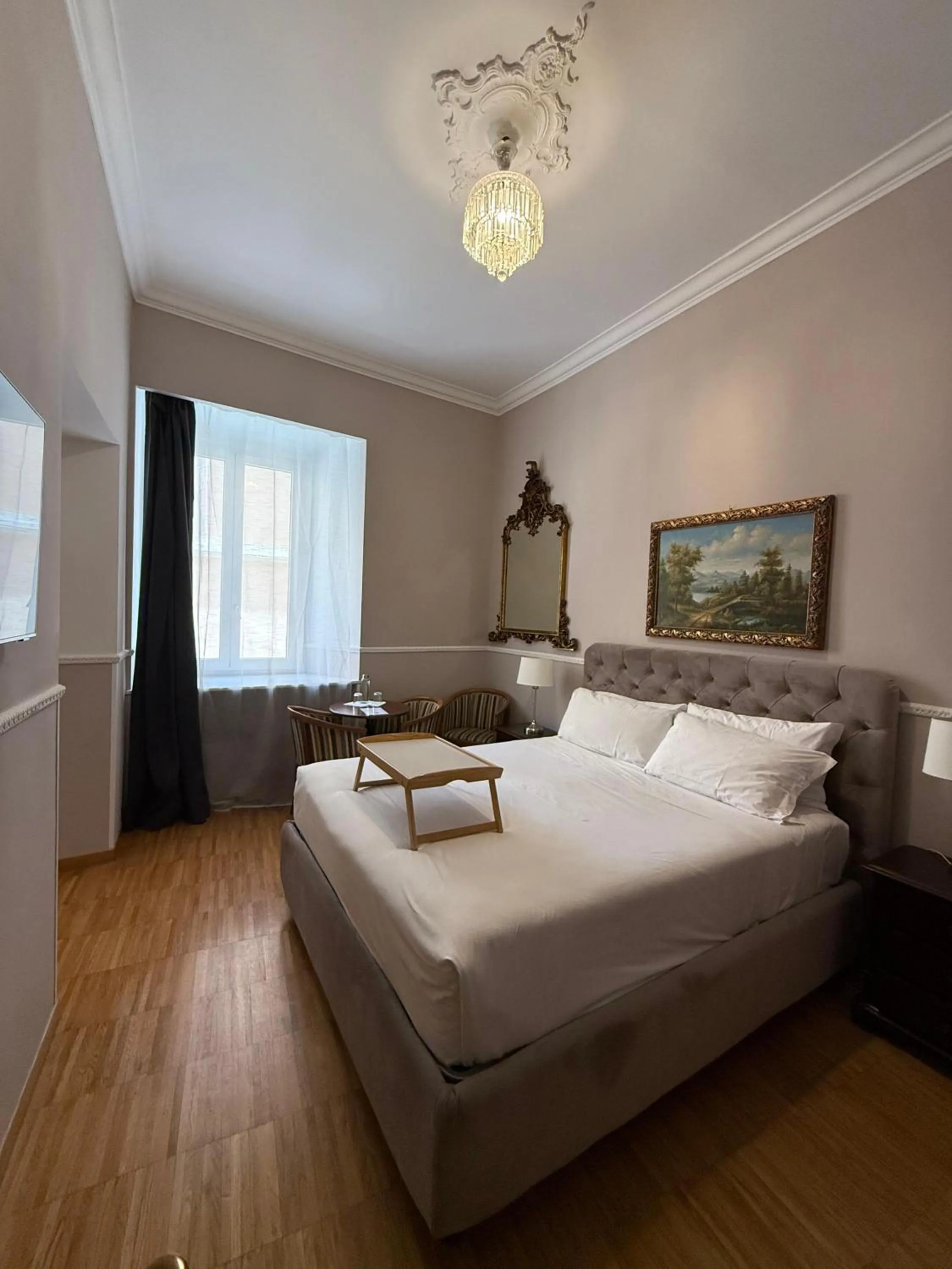 Bed in I TRE MOSCHETTIERI - D'ARTAGNAN Luxury Guest House