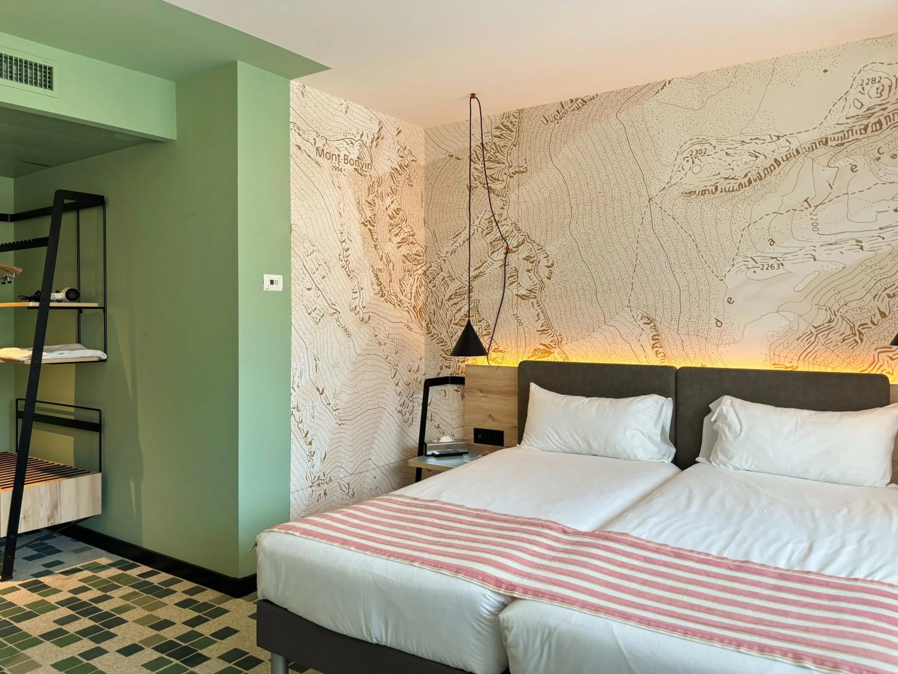 Bed in Nonanteneuf appart hōtel Sierre - contactless check-in