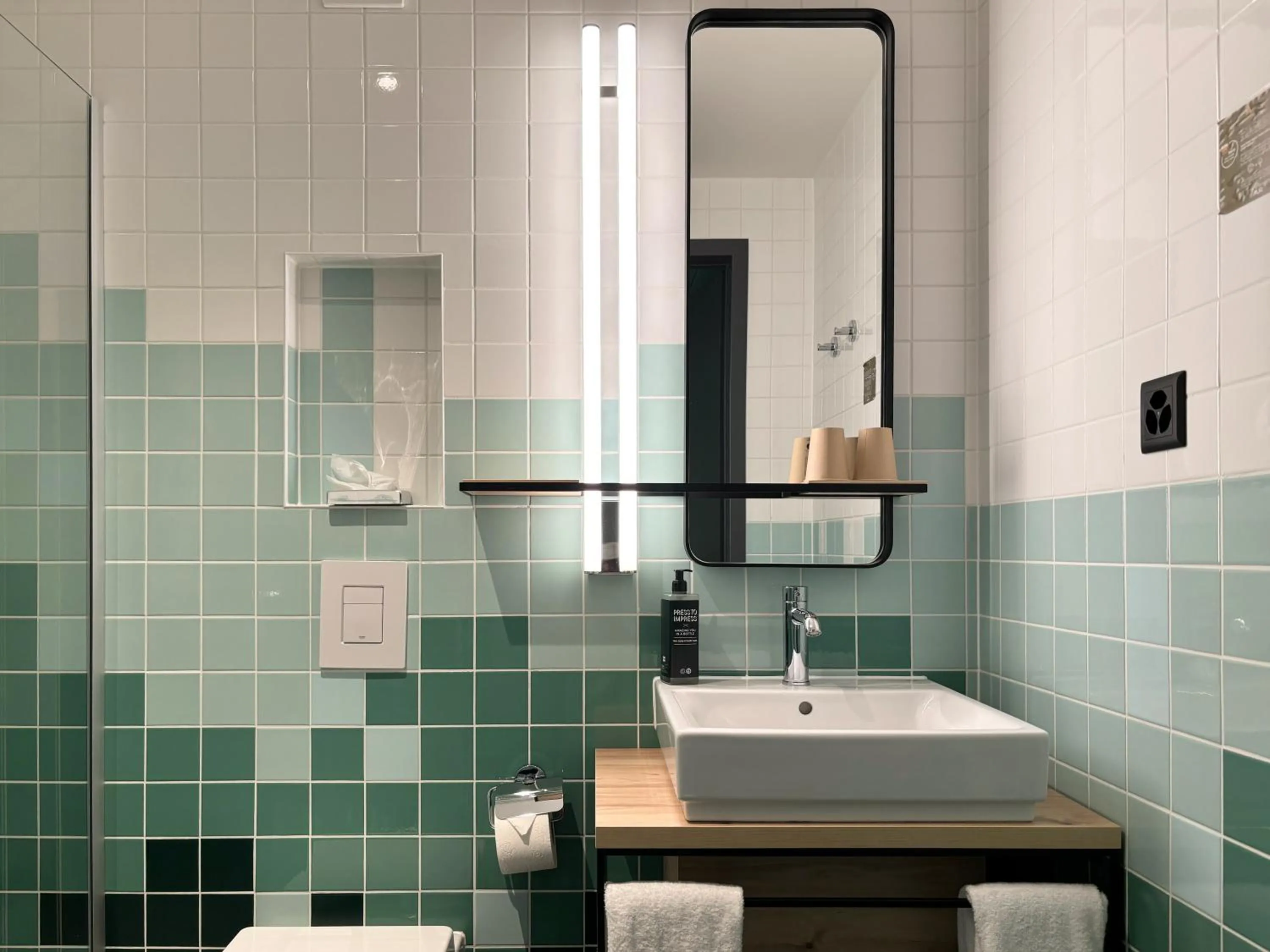 Bathroom in Nonanteneuf appart hōtel Sierre - contactless check-in