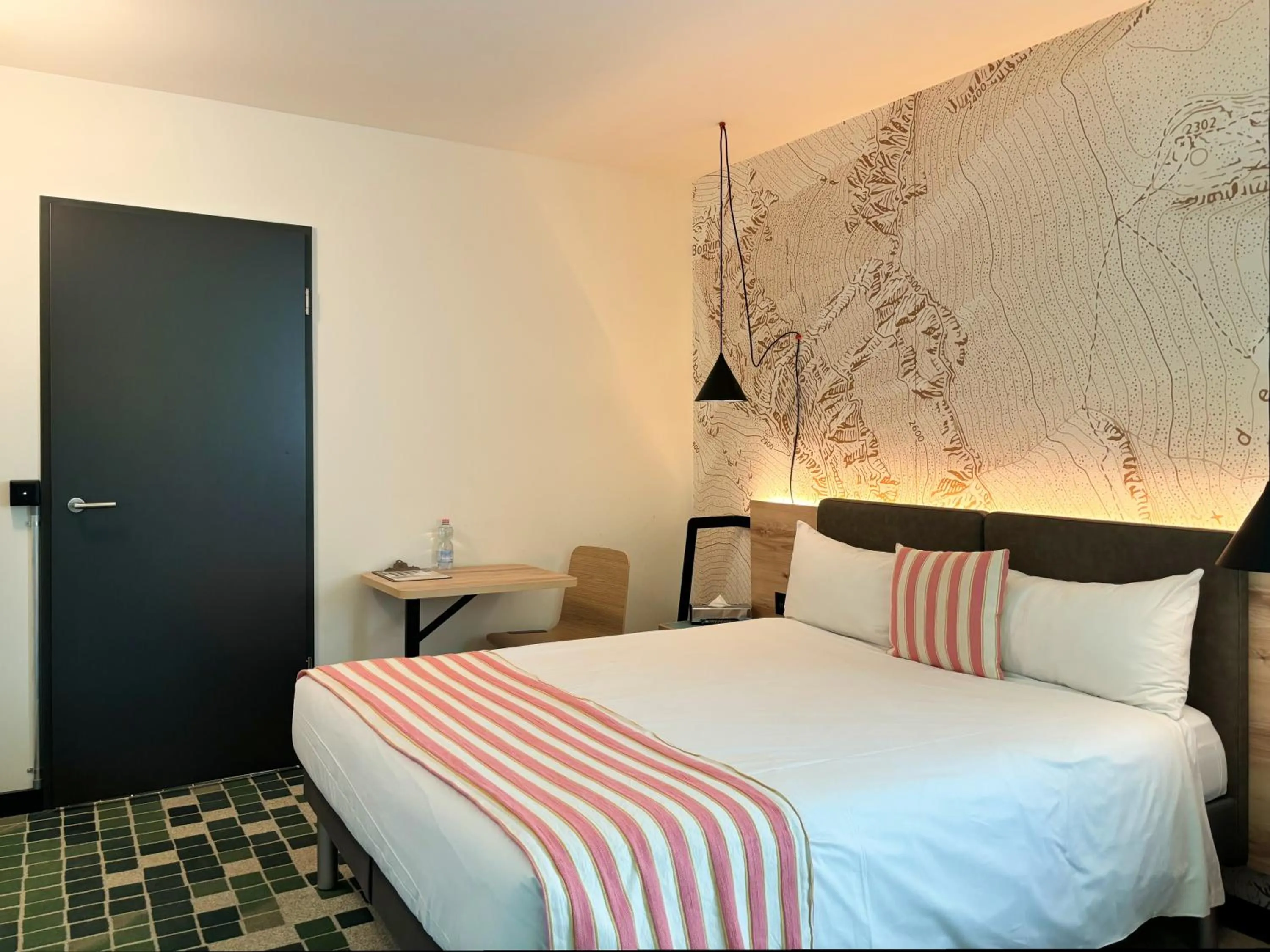 Bed in Nonanteneuf appart hōtel Sierre - contactless check-in