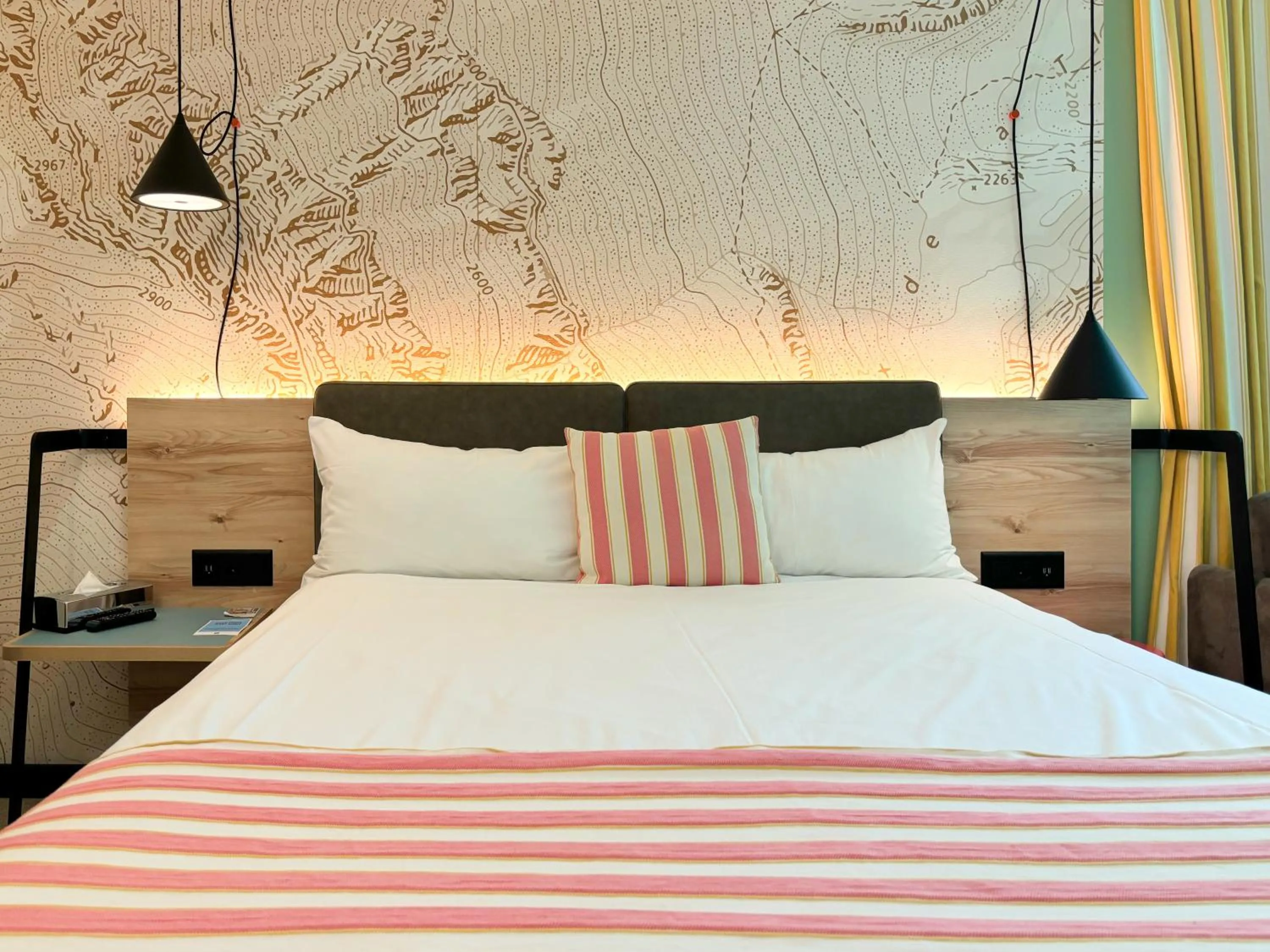 Bed in Nonanteneuf appart hōtel Sierre - contactless check-in