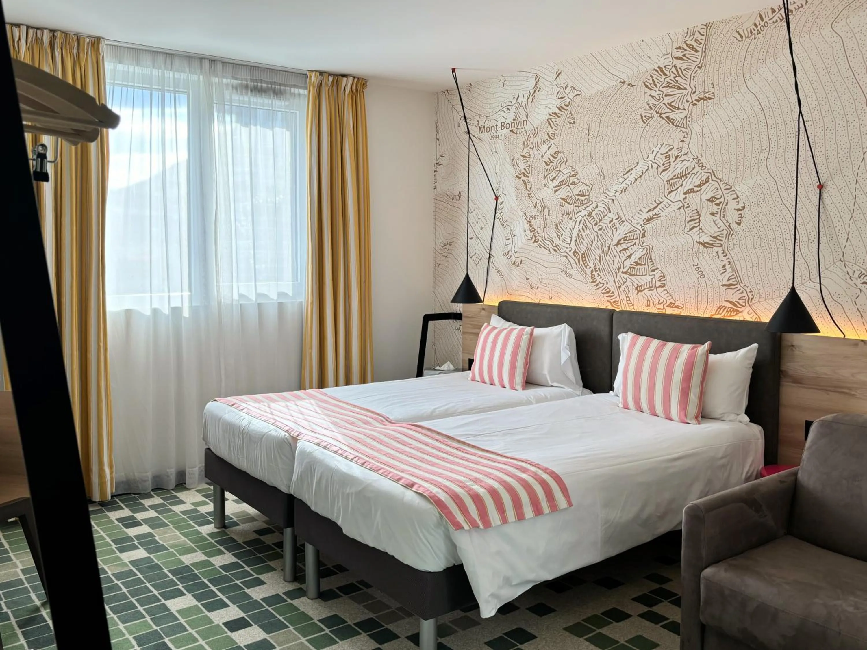 Bed in Nonanteneuf appart hōtel Sierre - contactless check-in