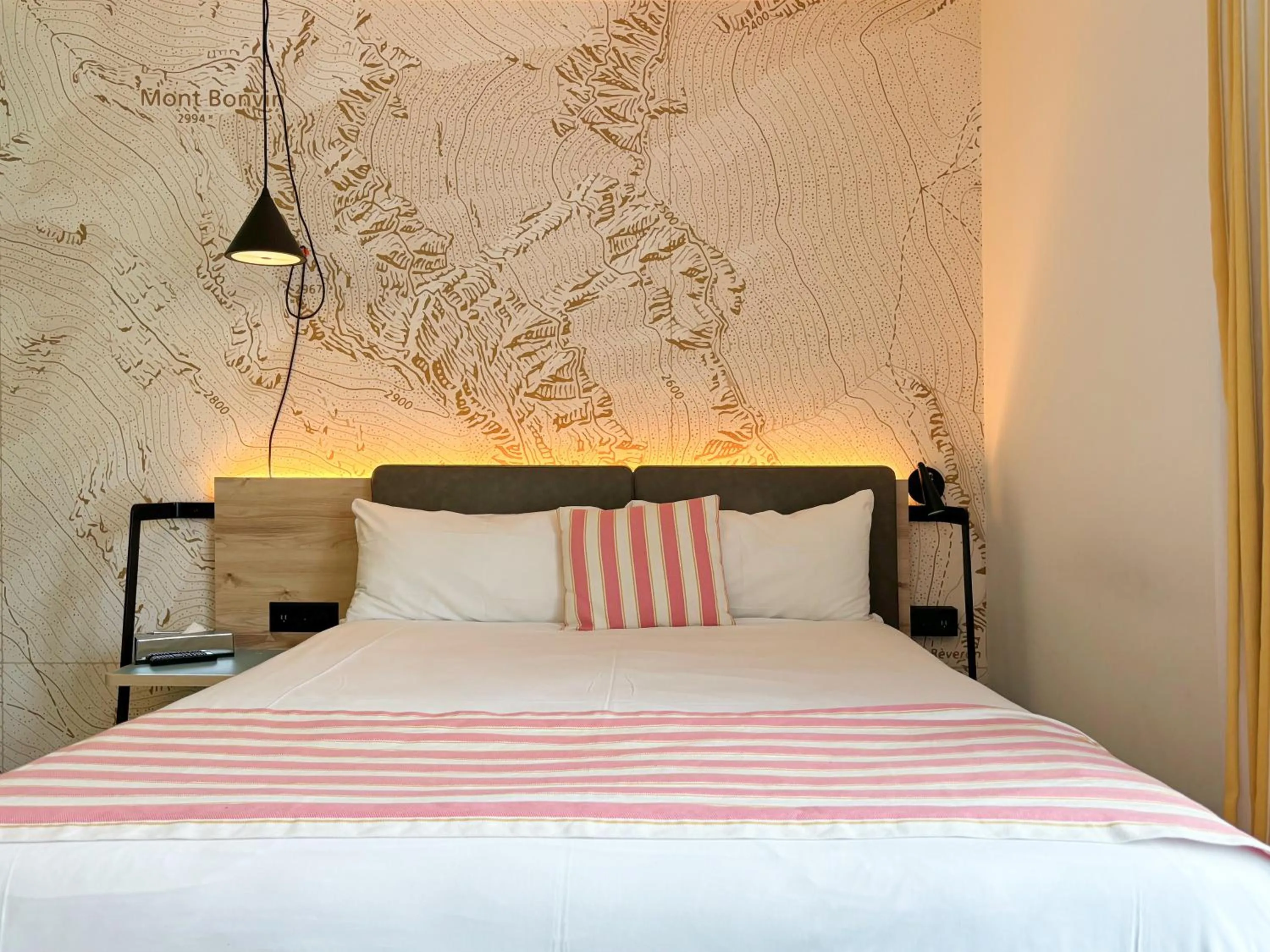 Bed in Nonanteneuf appart hōtel Sierre - contactless check-in