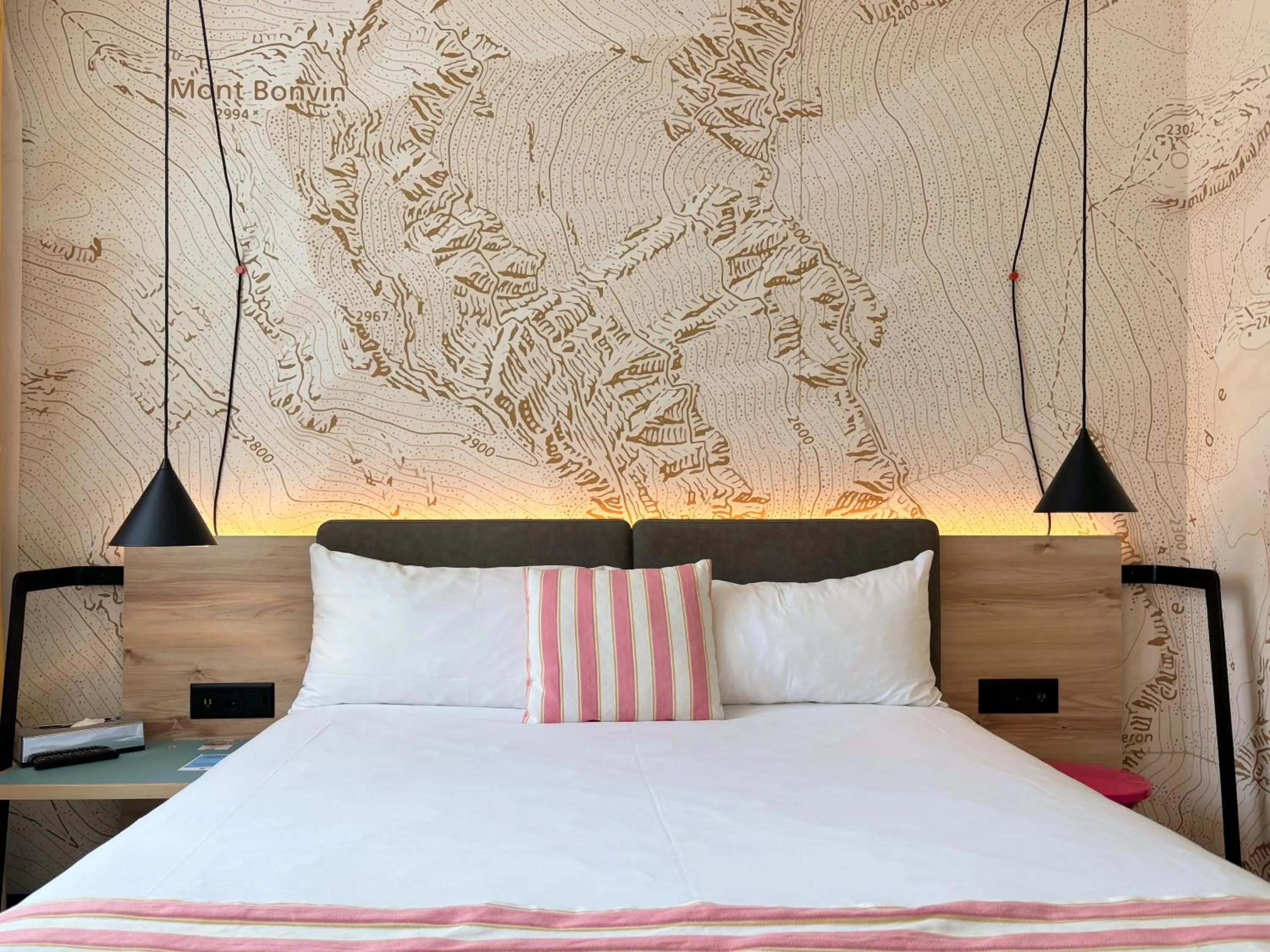 Bed in Nonanteneuf appart hōtel Sierre - contactless check-in