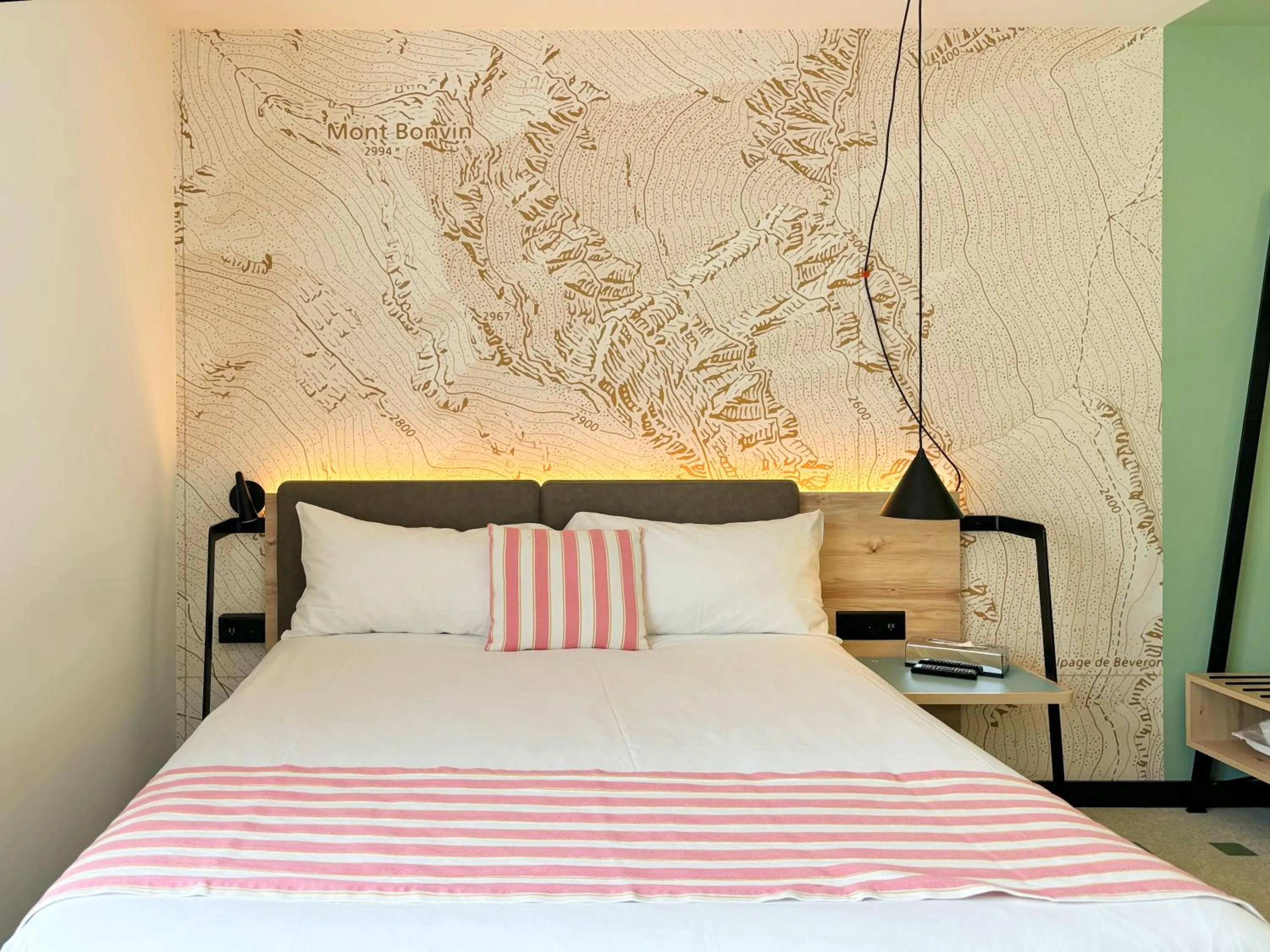 Bed in Nonanteneuf appart hōtel Sierre - contactless check-in