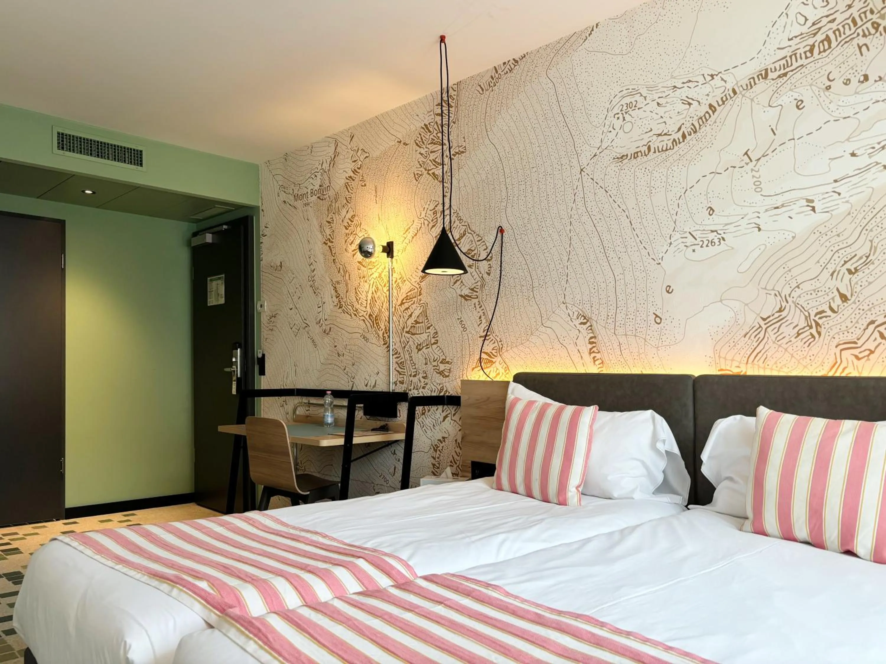 Bed in Nonanteneuf appart hōtel Sierre - contactless check-in