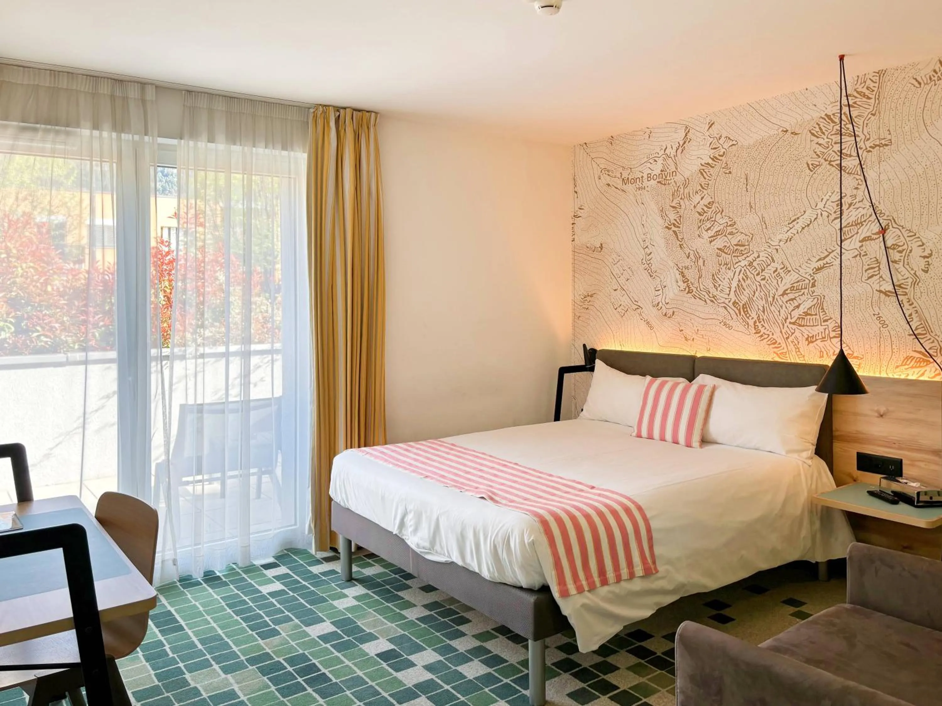 Bed in Nonanteneuf appart hōtel Sierre - contactless check-in