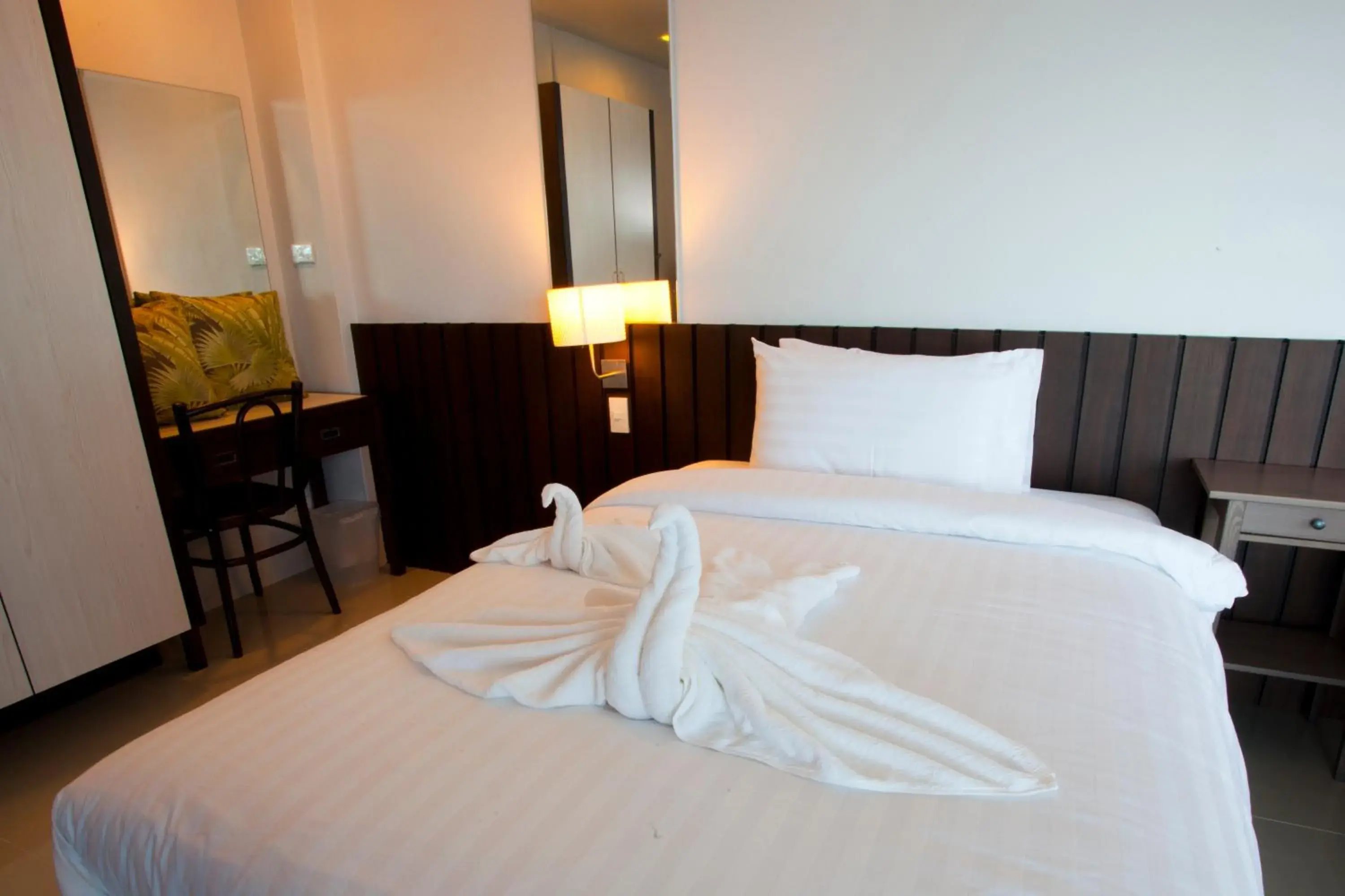 Bed in Prasarnsook Villa Beach Resort Bed in Prasarnsook Villa Beach Resort