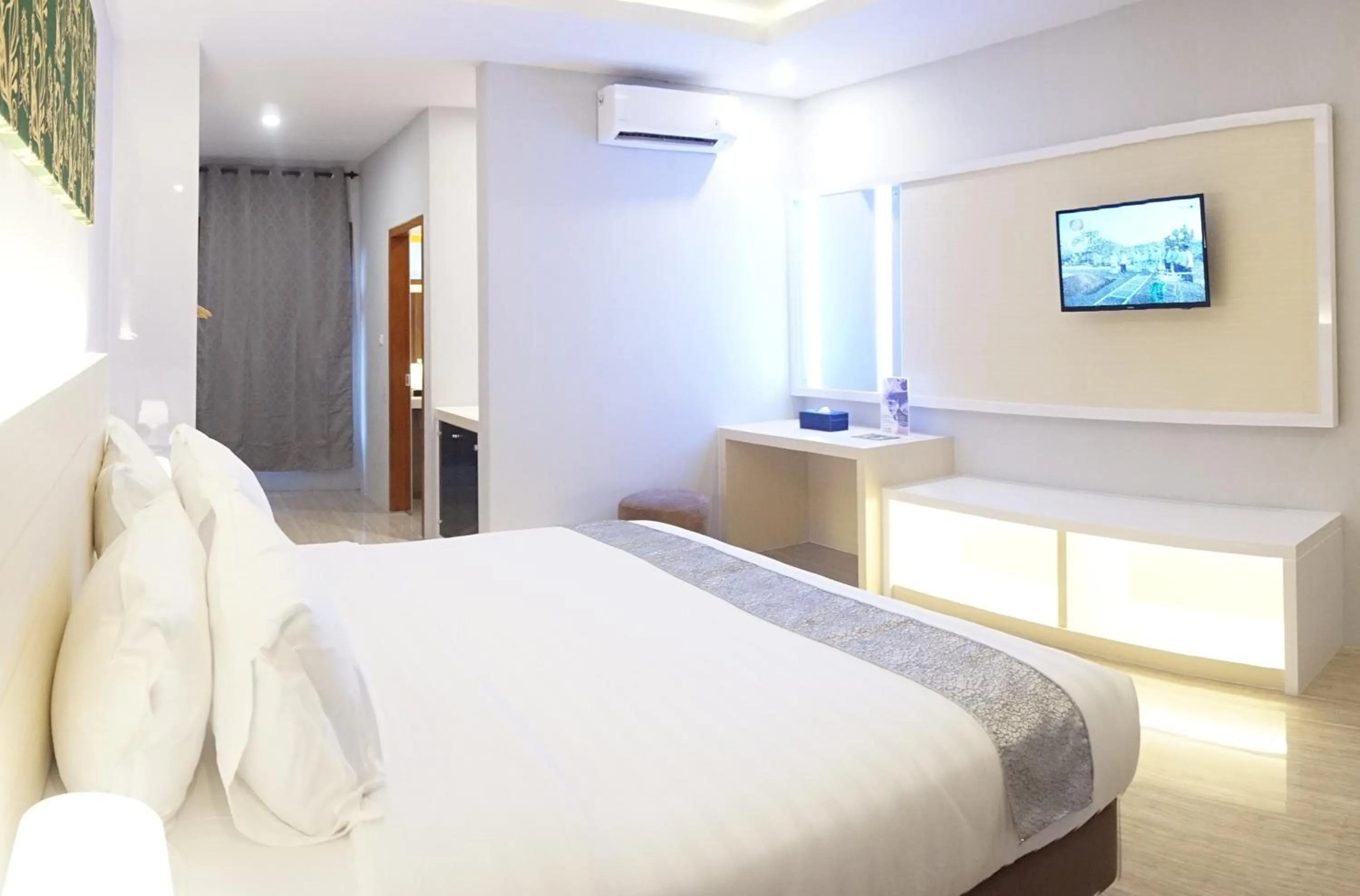 Bed in Grand Harvest Resort & Villas