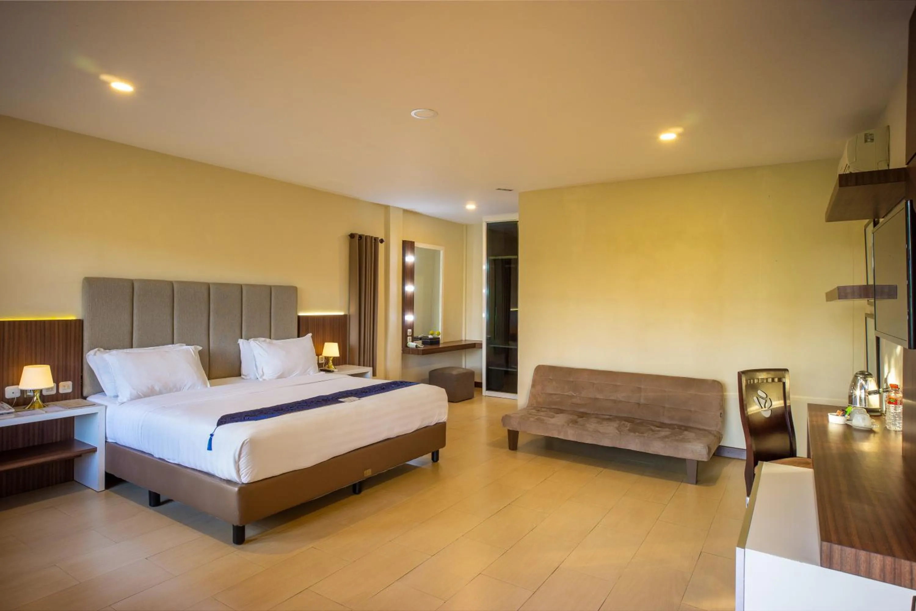 Bed in Grand Harvest Resort & Villas