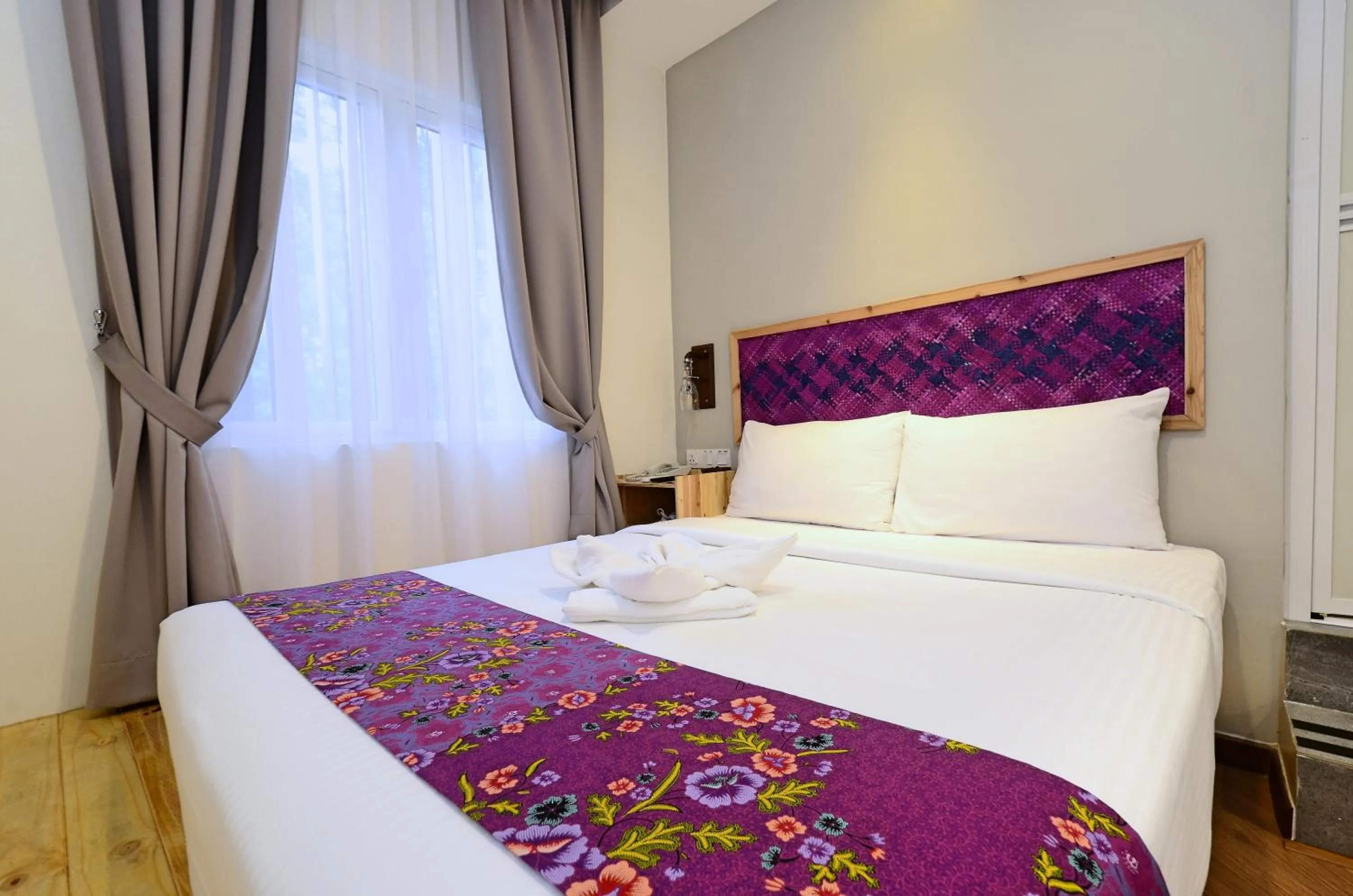 Bed in Artisan Eco Hotel