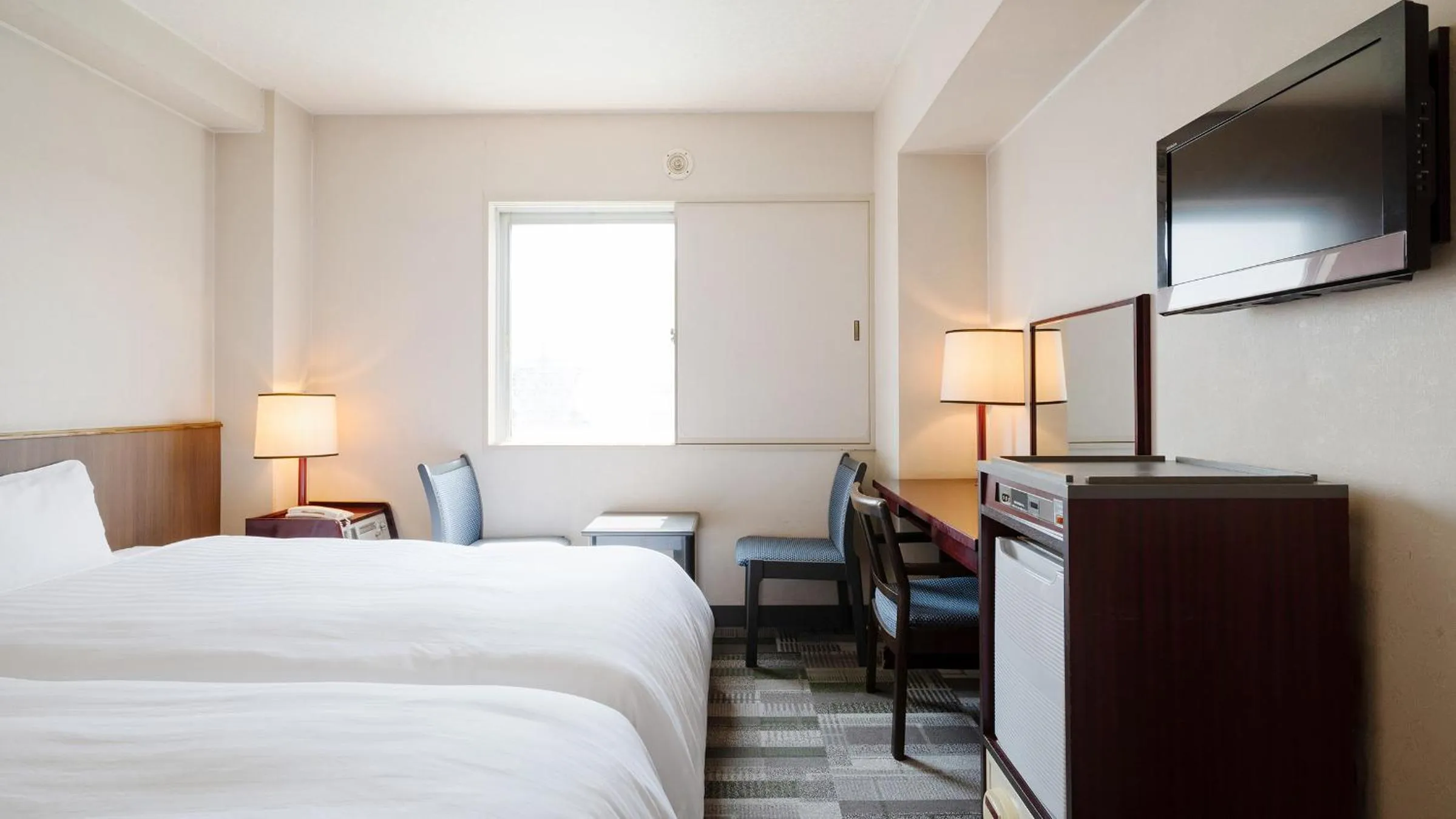 Bed in Hotel Paco Obihiro Chuo