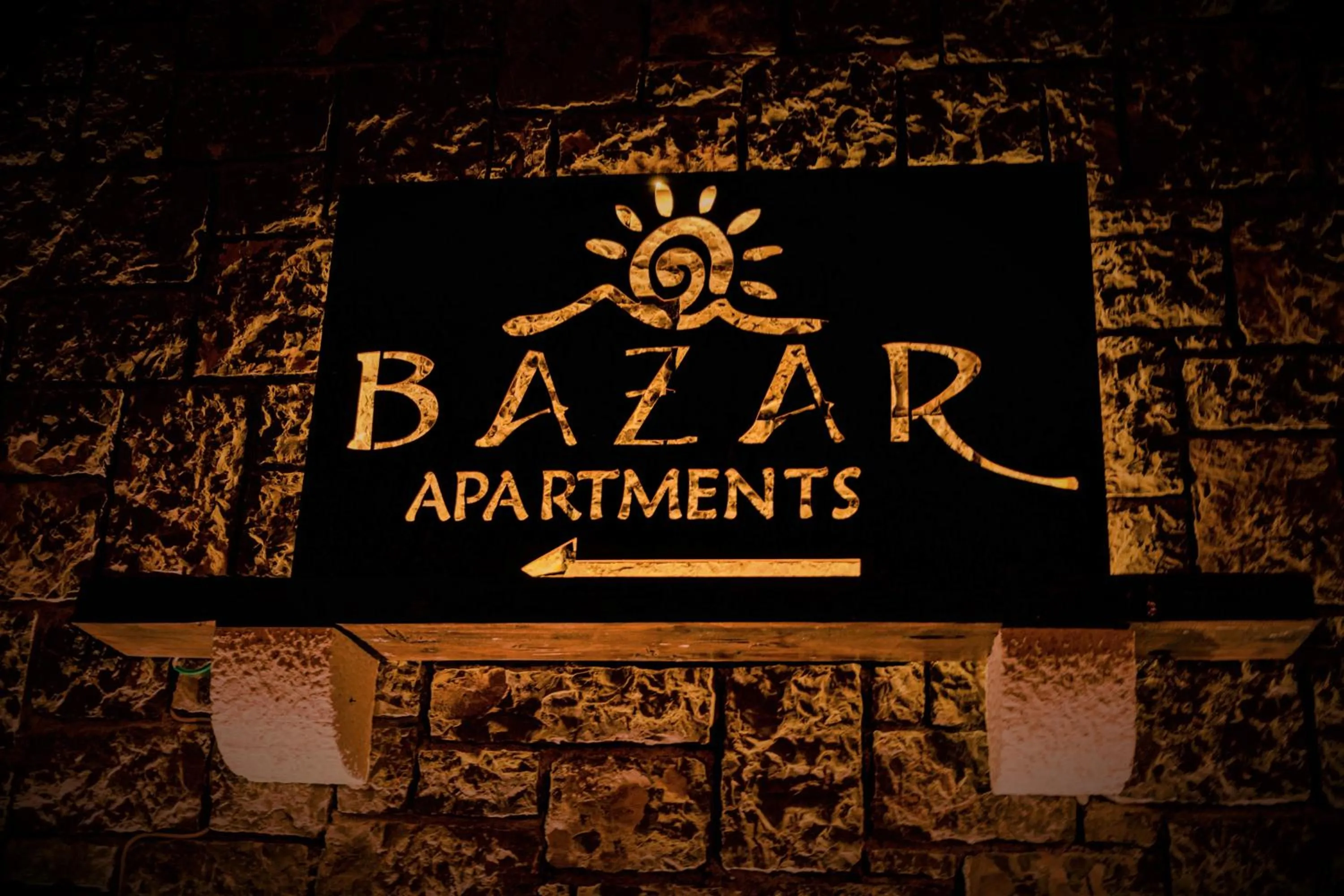Property logo or sign in Apartments Bazar