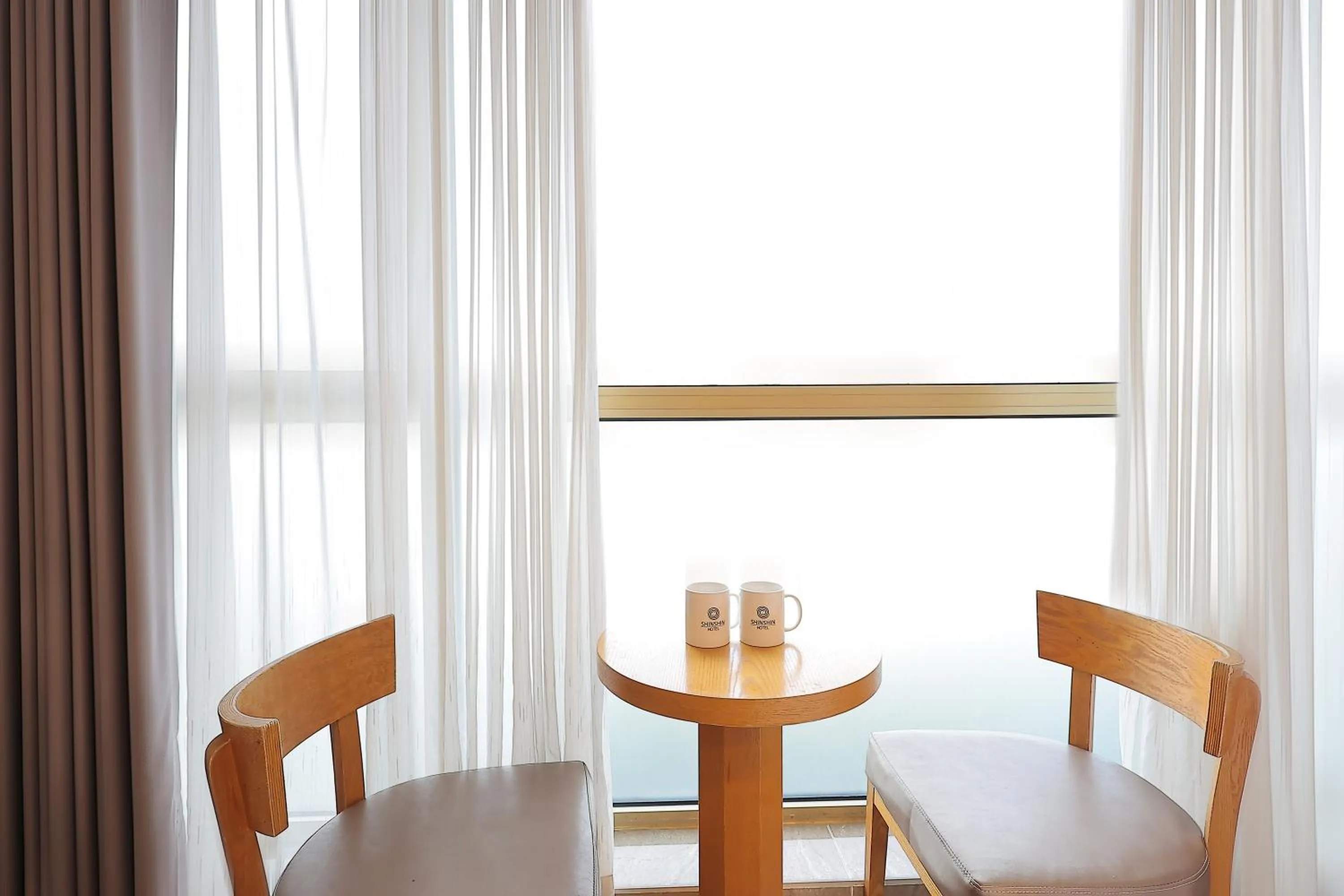 Seating area in Shin Shin Hotel Jeju City