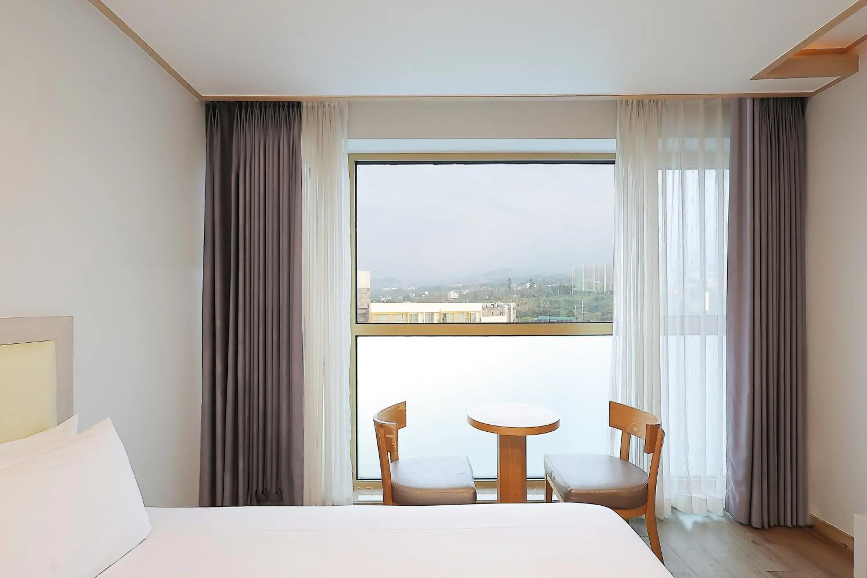 View (from property/room), Bed in Shin Shin Hotel Jeju City View (from property/room), Bed in Shin Shin Hotel Jeju City