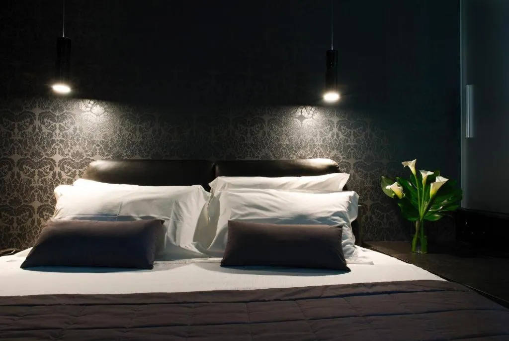 Bed in Gatto Bianco Mia Aparthotel