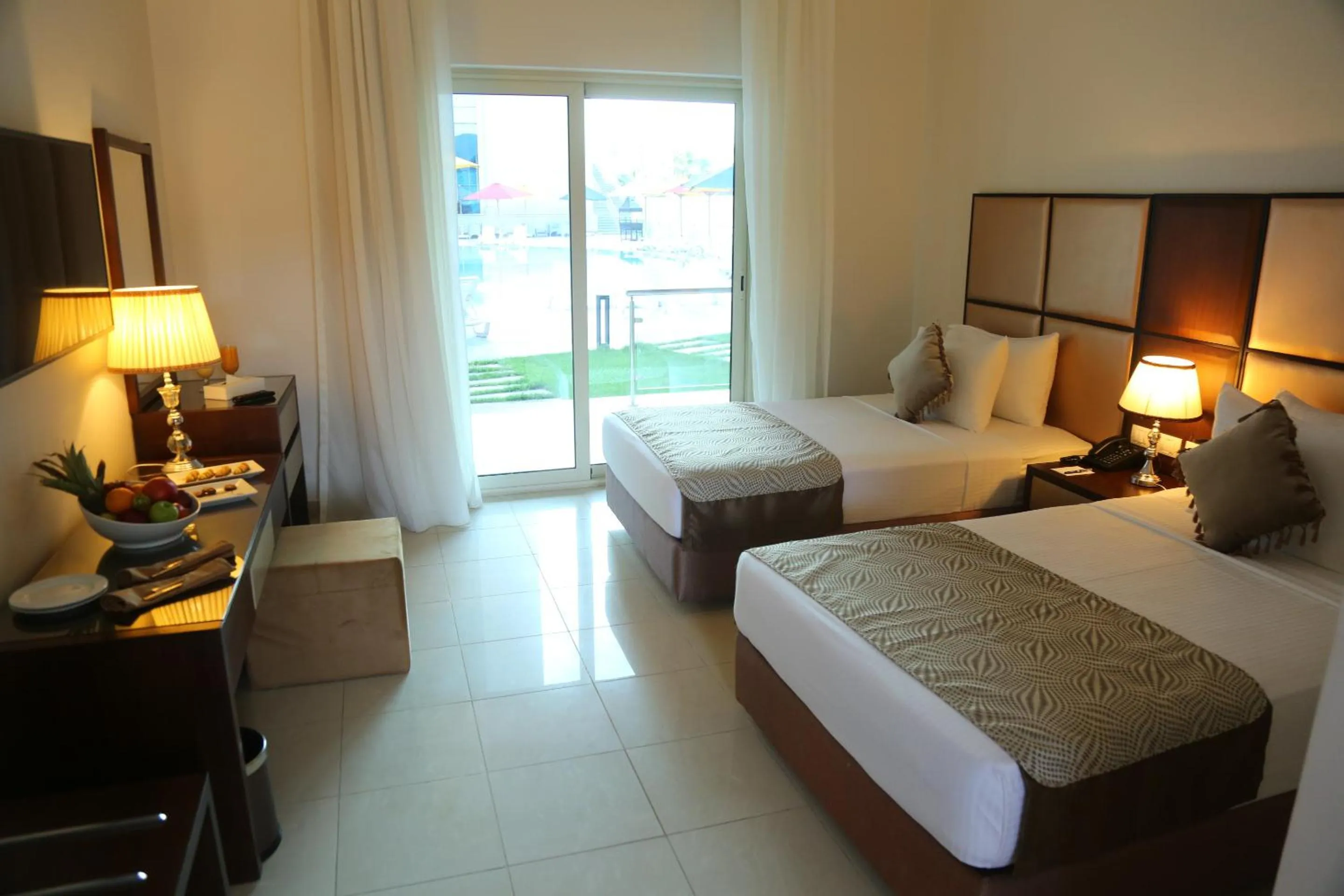 Pool view, Bed in Tolip Golden Plaza