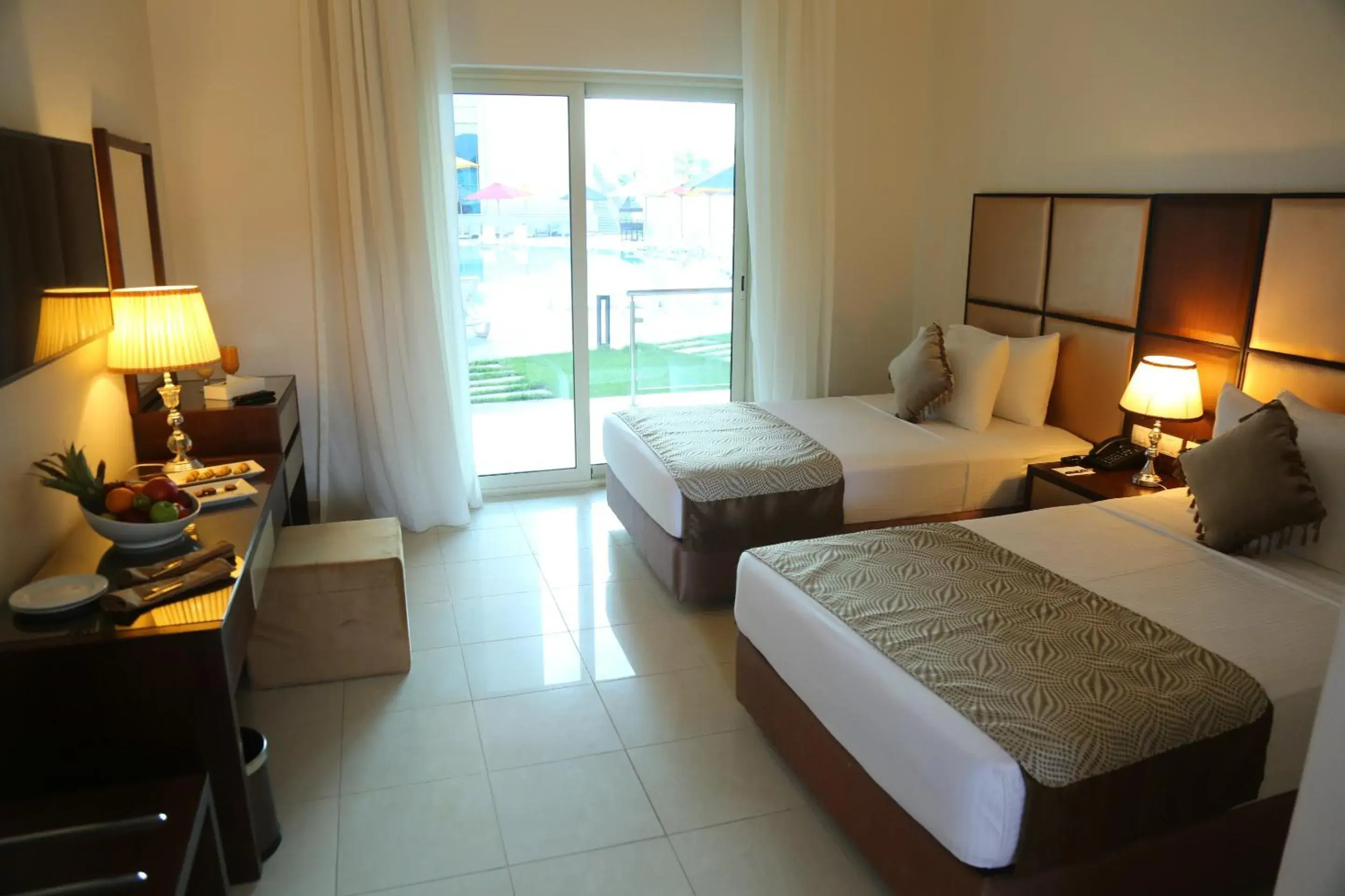 Pool view, Bed in Tolip Golden Plaza Pool view, Bed in Tolip Golden Plaza