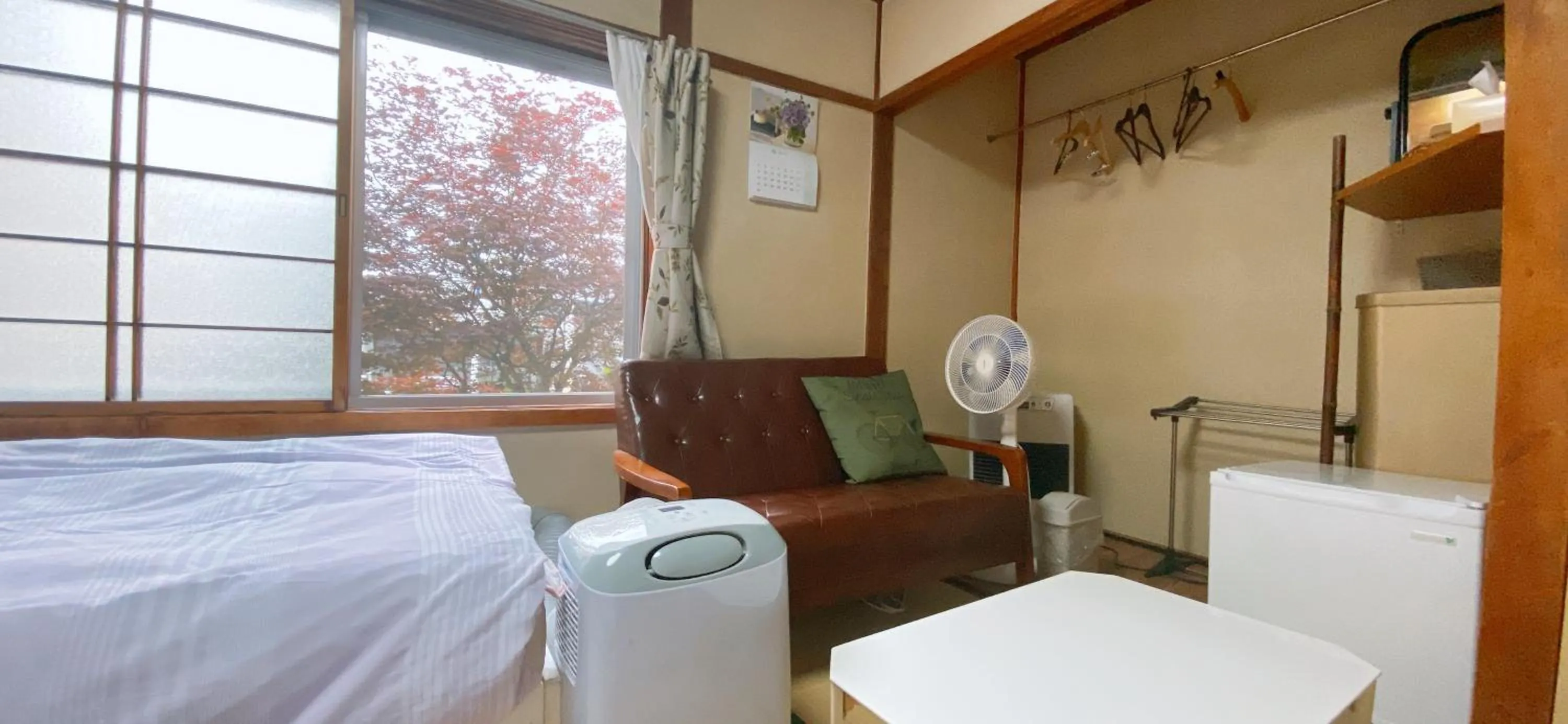Seating area, Bed in Ryokan Sansui