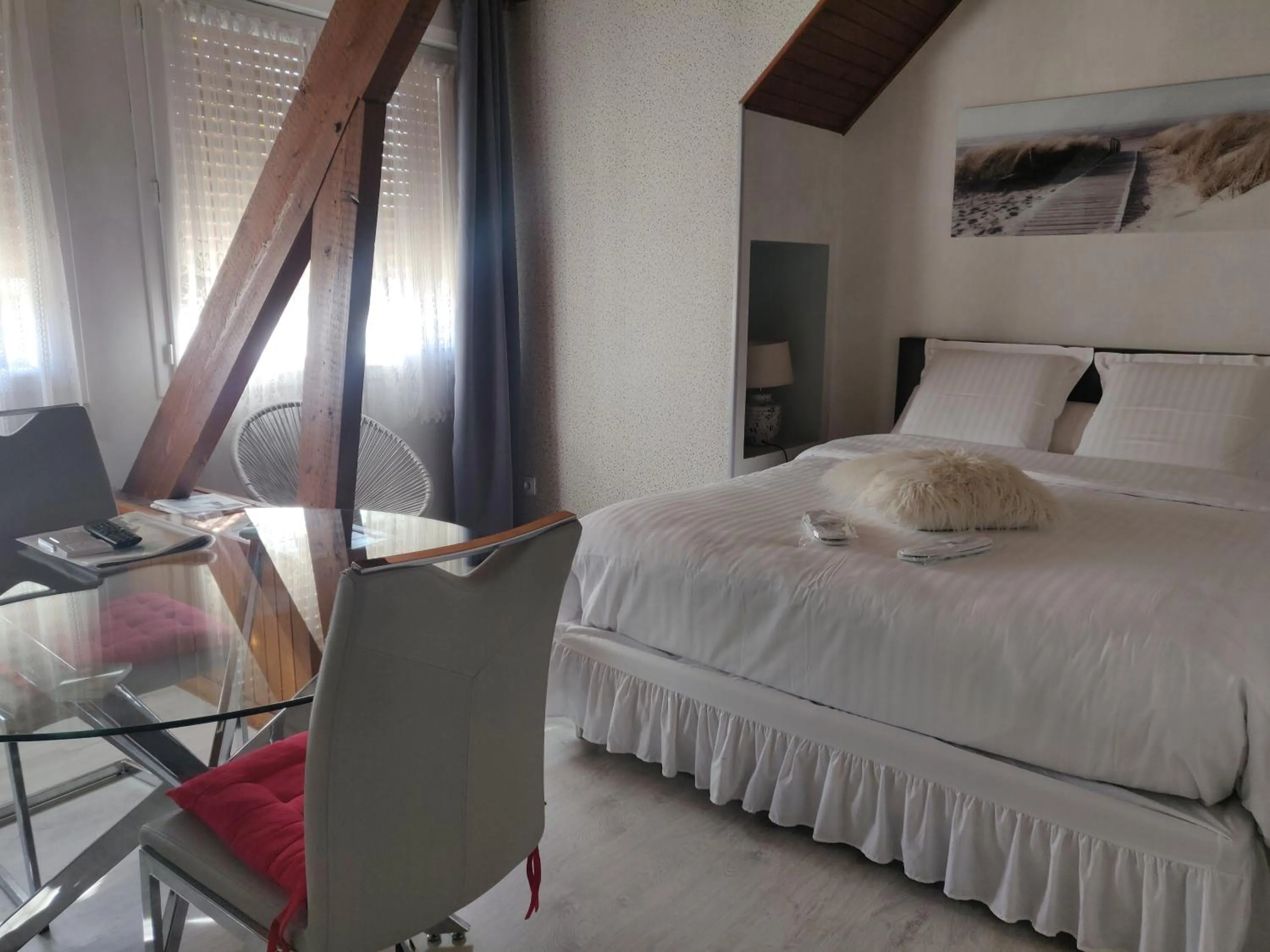 Bed in Chambres du Jardin Fleuri