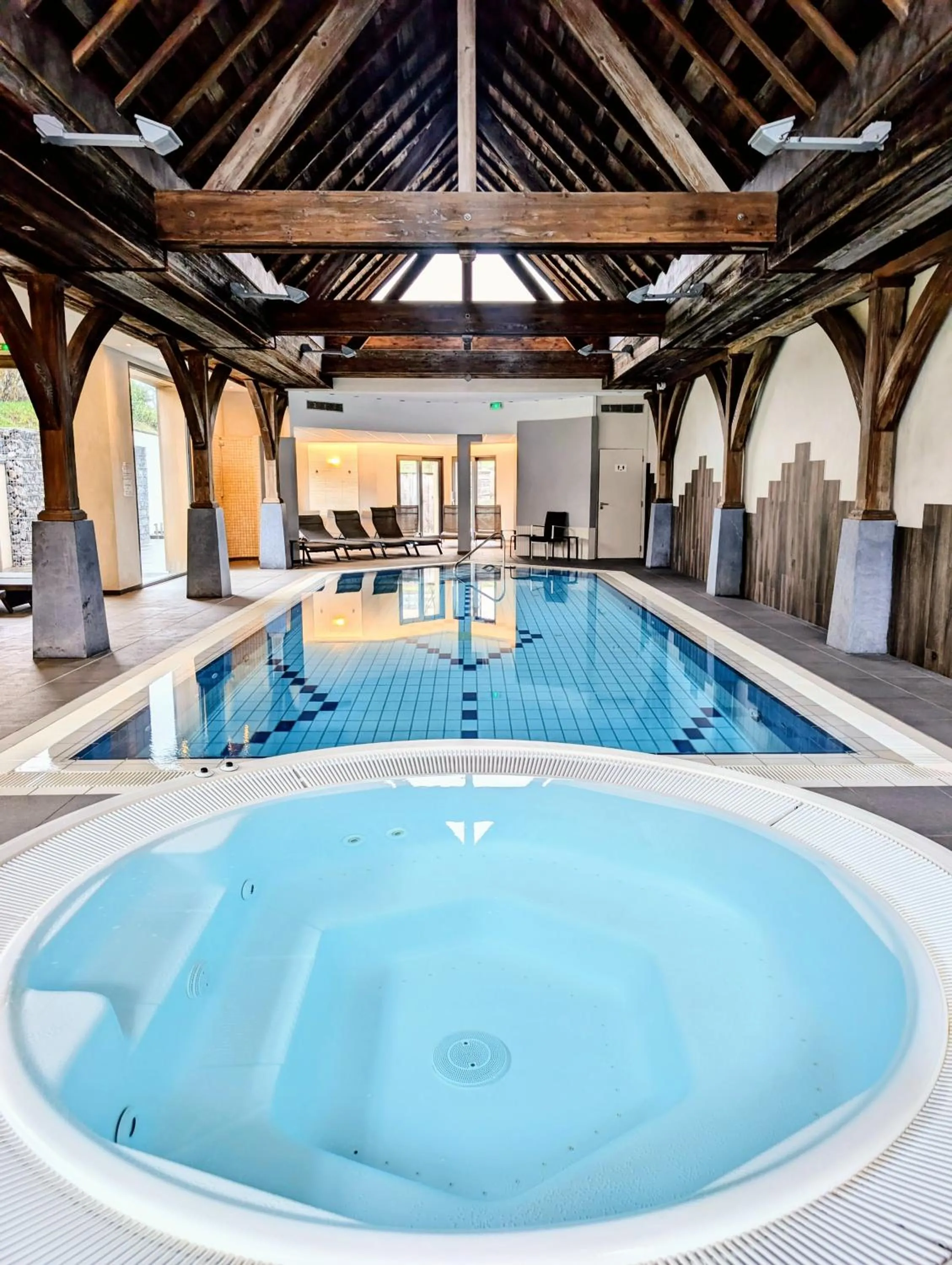 Swimming pool in Logis Hotel Le Parc & Spa