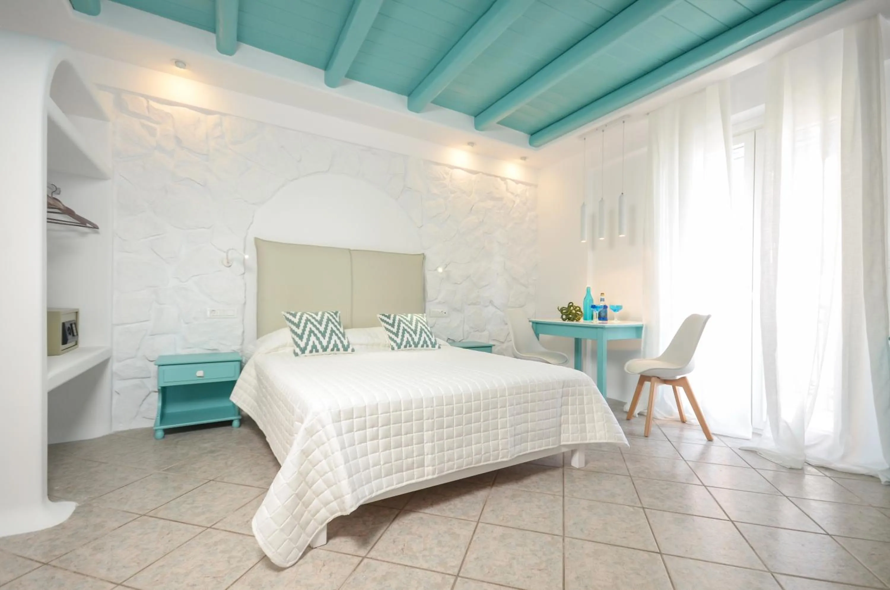 Photo of the whole room, Bed in Naxos Evilion Luxury Apartments & Suites