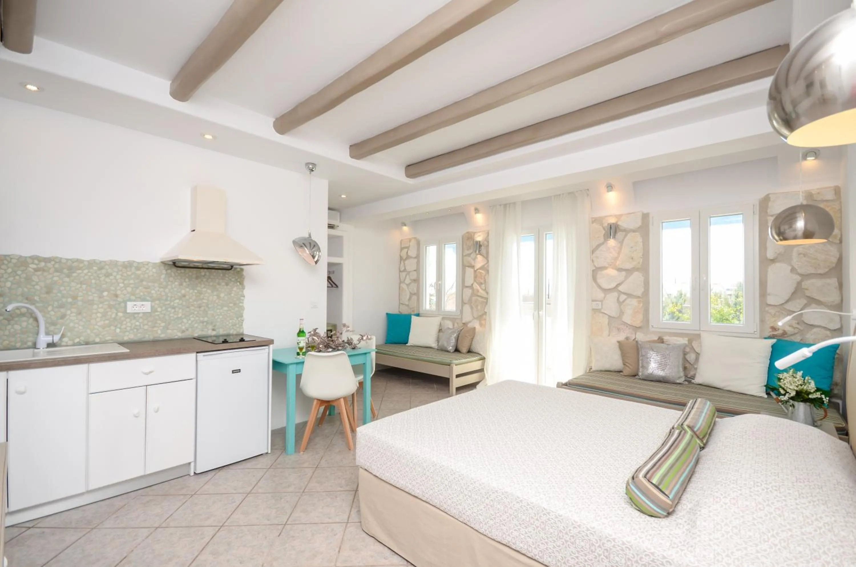Photo of the whole room, Bed in Naxos Evilion Luxury Apartments & Suites