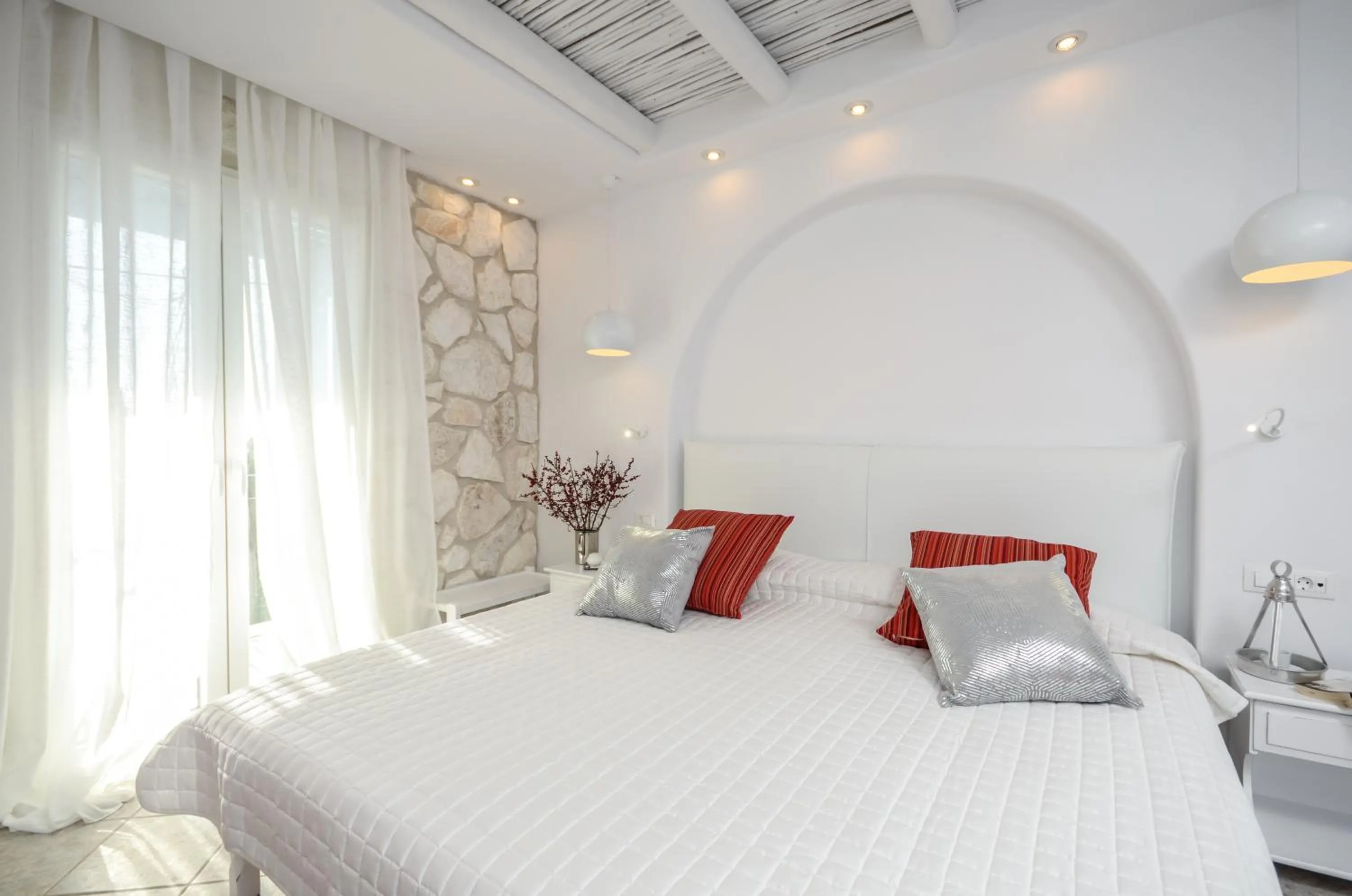 Bed in Naxos Evilion Luxury Apartments & Suites