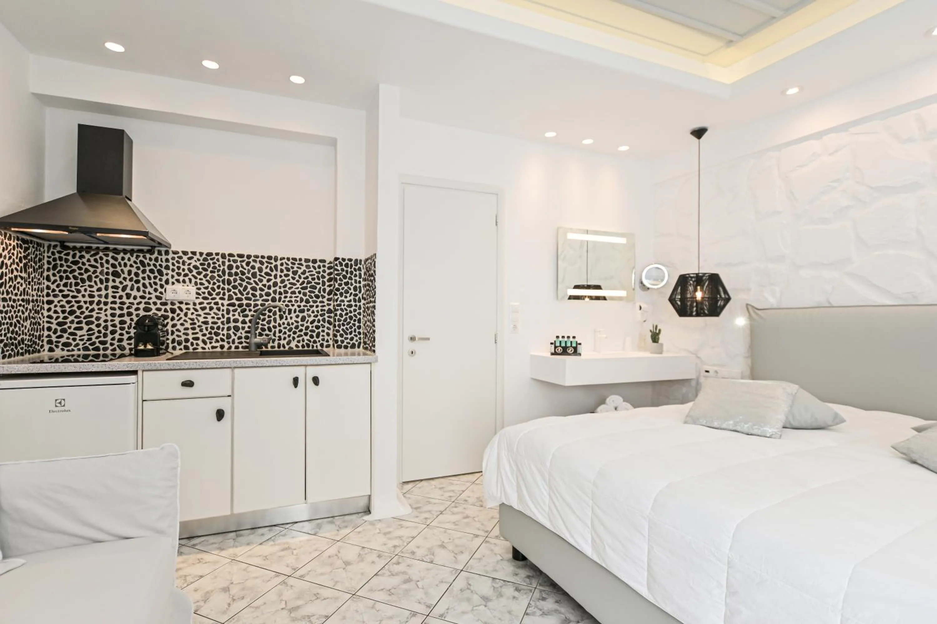 Bed in Naxos Evilion Luxury Apartments & Suites