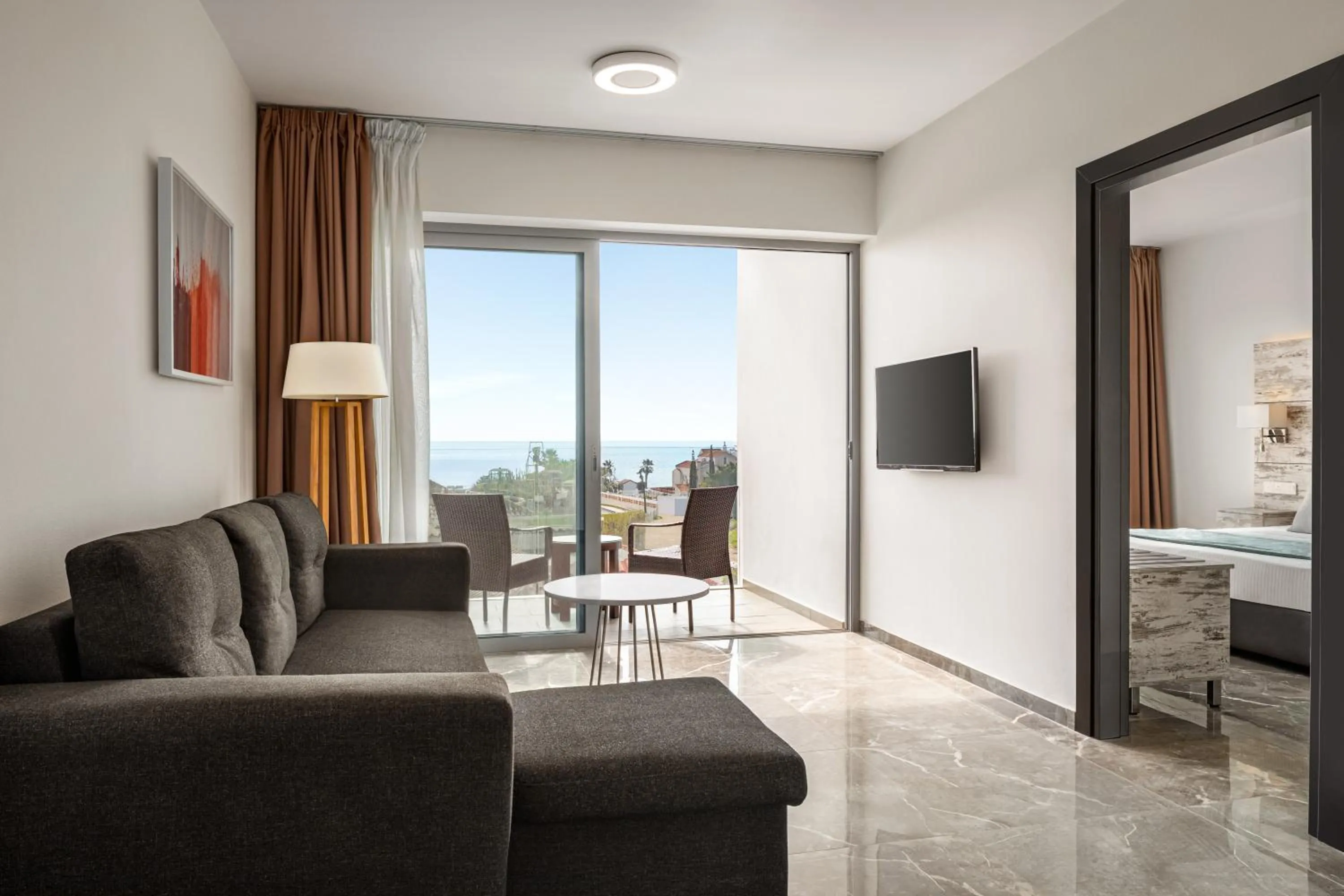 Living room in Ramada Hotel & Suites by Wyndham Ayia Napa
