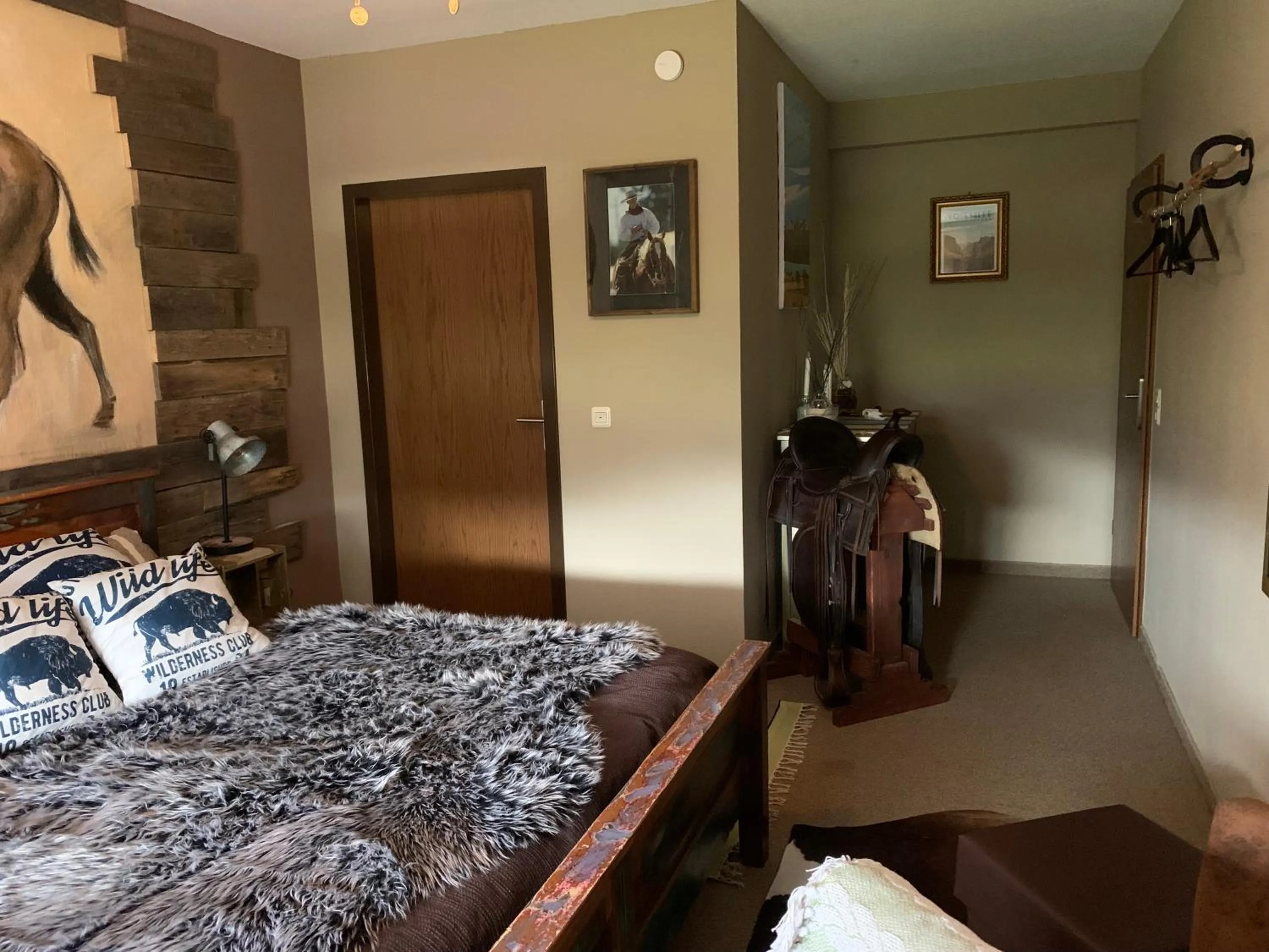 Bedroom in Longhorn Ranch Countryhotel - Garni